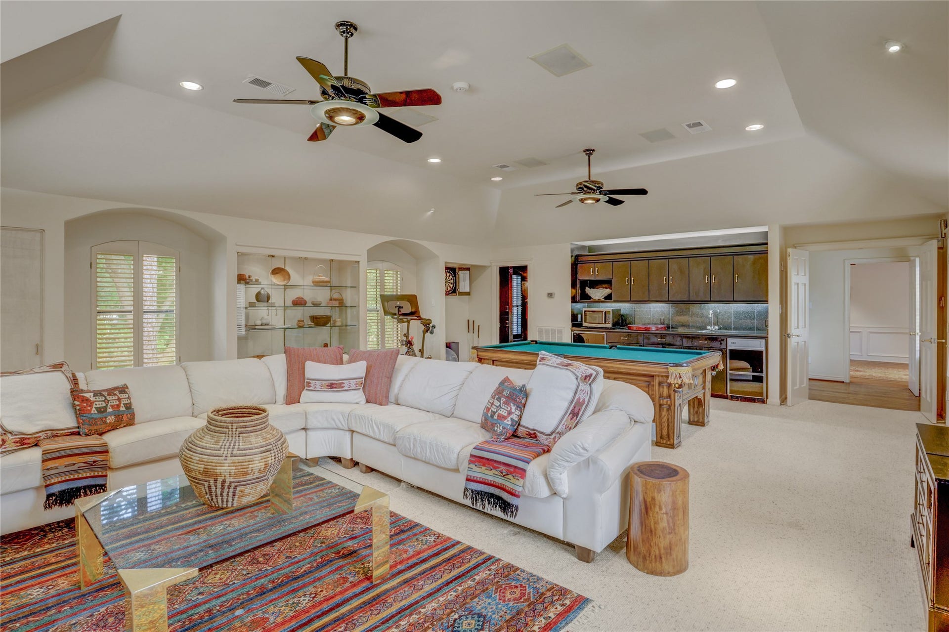The upstairs game room will be the place for movies as well as a game of pool 
there is a wet bar with refrigerator for movie snacks and a soda.  There is also a full bath