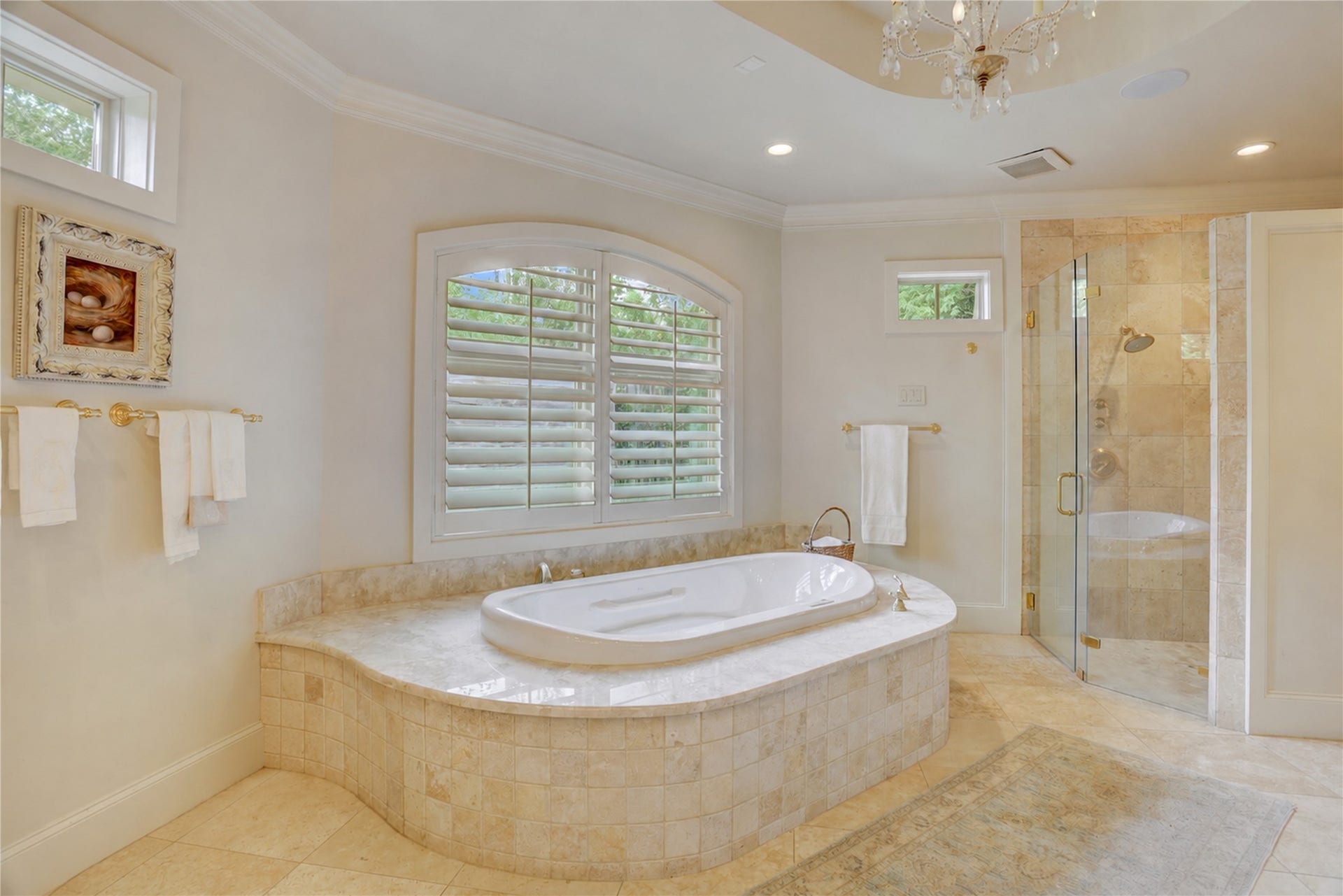 The primary bath with an air jetted tub, shower and numerous amenities