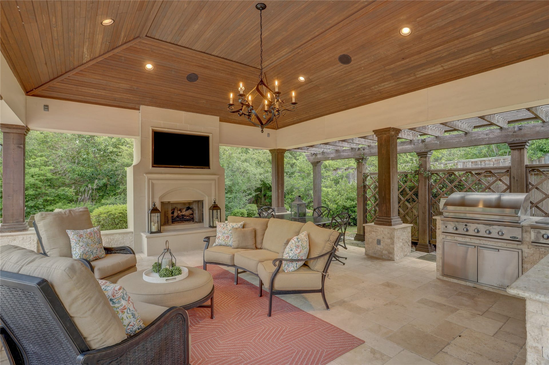 Another view of the pavilion with grill, refrigerator, tv and seating space