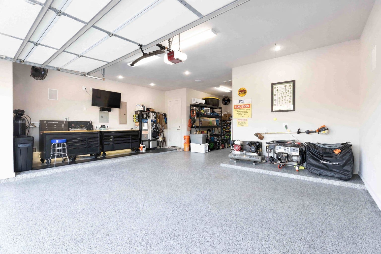 6 Canopy Green Drive, Tomball, TX 77375 fully equipped garage with lighting, 7.1 surround sound, seperate A/C, and whole home generator ready.