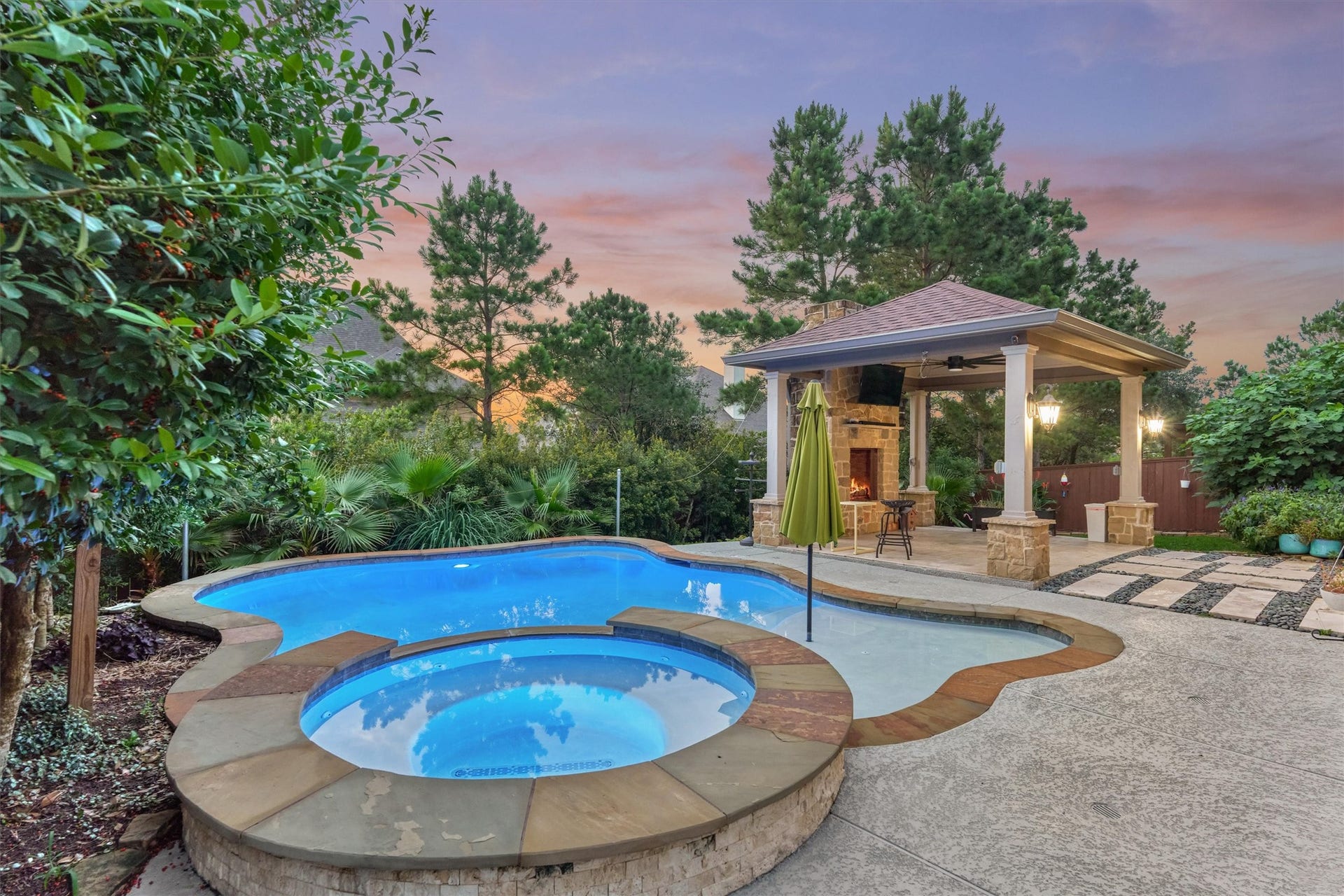 6 Canopy Green Drive, Tomball, TX 77375 nighttime by the pool is truly stunning