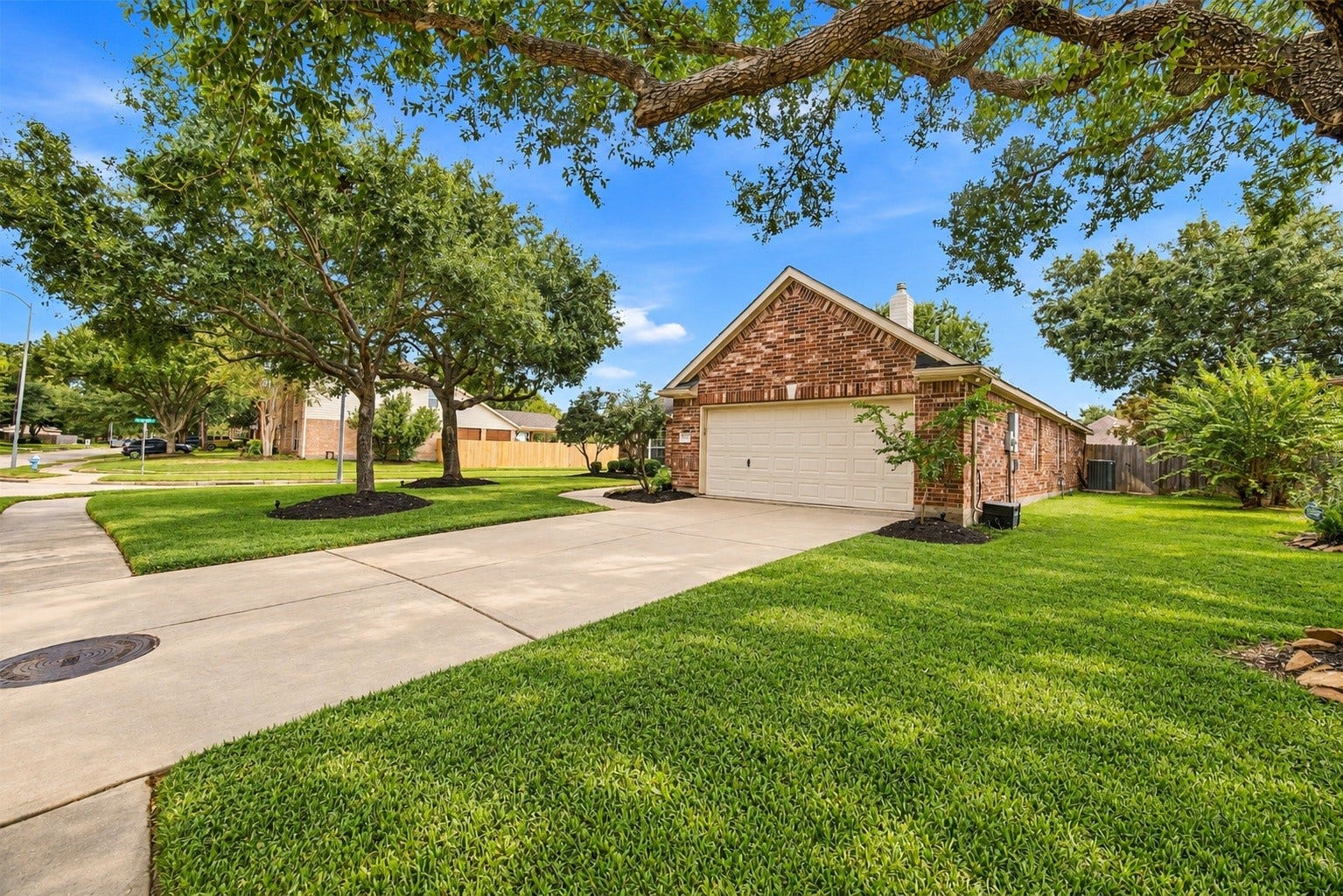 23706 Indian Hills Way, Katy, TX 77494 The home's double-wide driveway and attached two-car garage provide plenty of convenient parking.