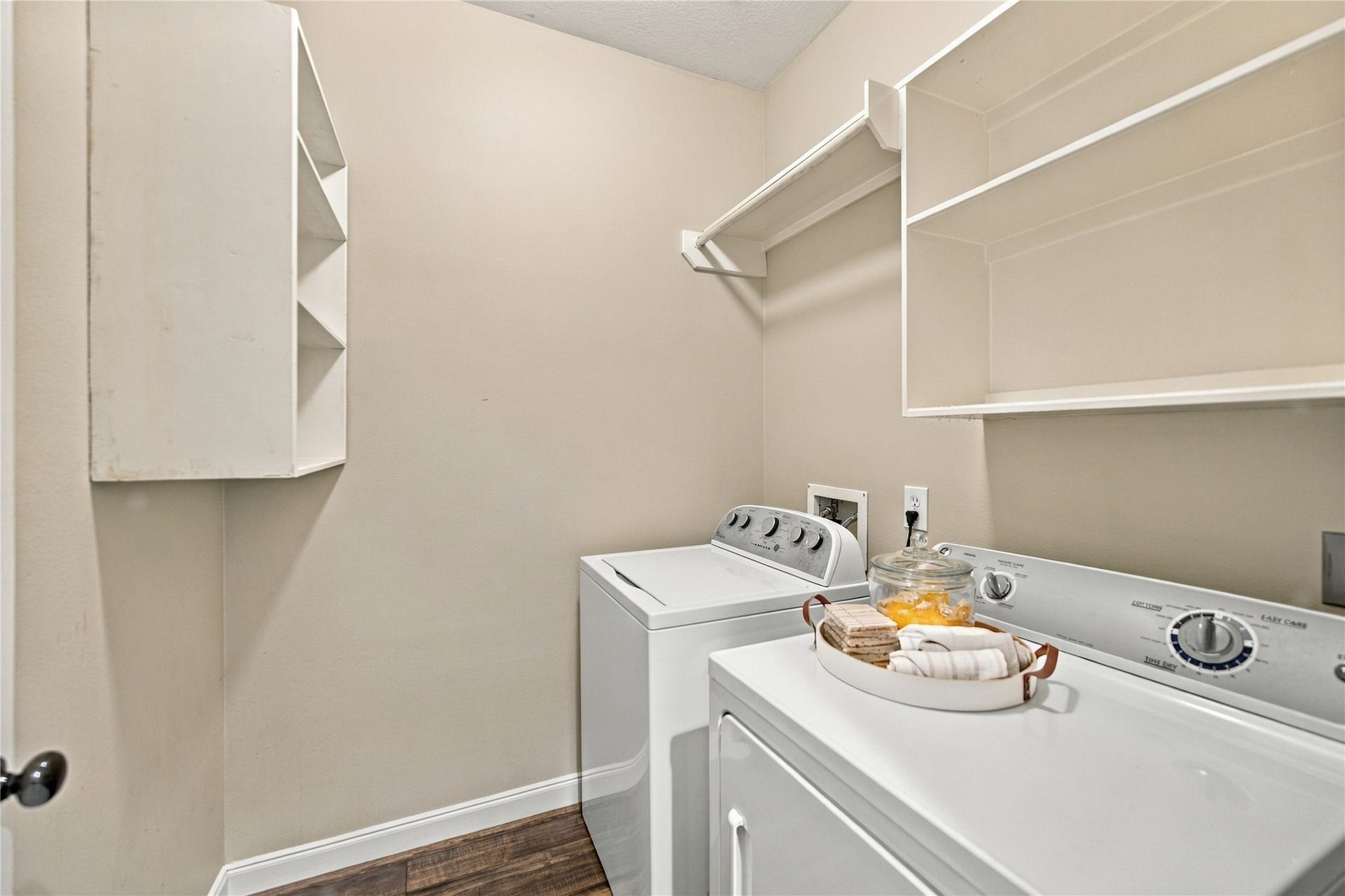 23706 Indian Hills Way, Katy, TX 77494 The laundry room is located conveniently off the kitchen. Complete with washer and dryer for your use, it contains hanging space and plentiful open shelving.