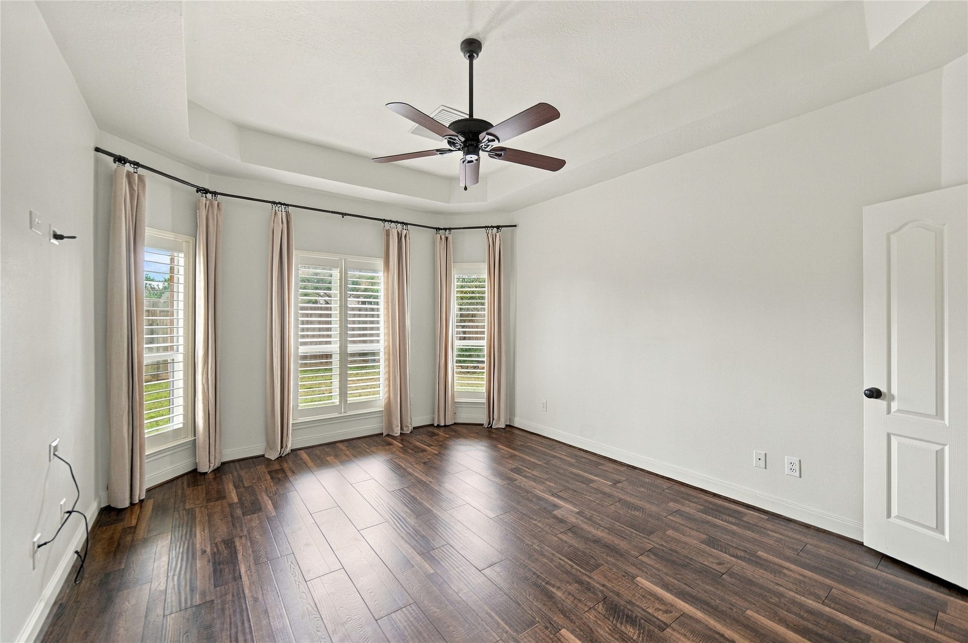23706 Indian Hills Way, Katy, TX 77494 On to the primary suite where you will find a tray ceiling, abundant natural light, and additional plantation shutters!