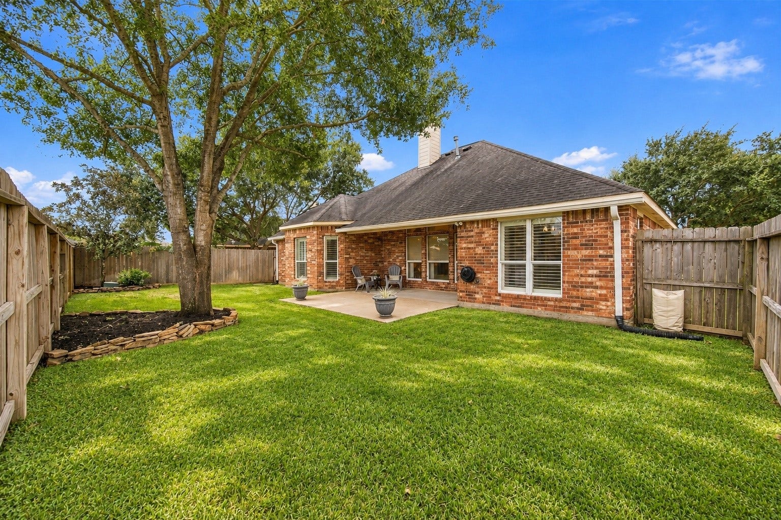 23706 Indian Hills Way, Katy, TX 77494 What a nice backyard! This fully fenced yard features a beautiful mature shade tree, space for outdoor activities, and a covered patio for entertaining. And with no rear neighbors, you'll enjoy added privacy!