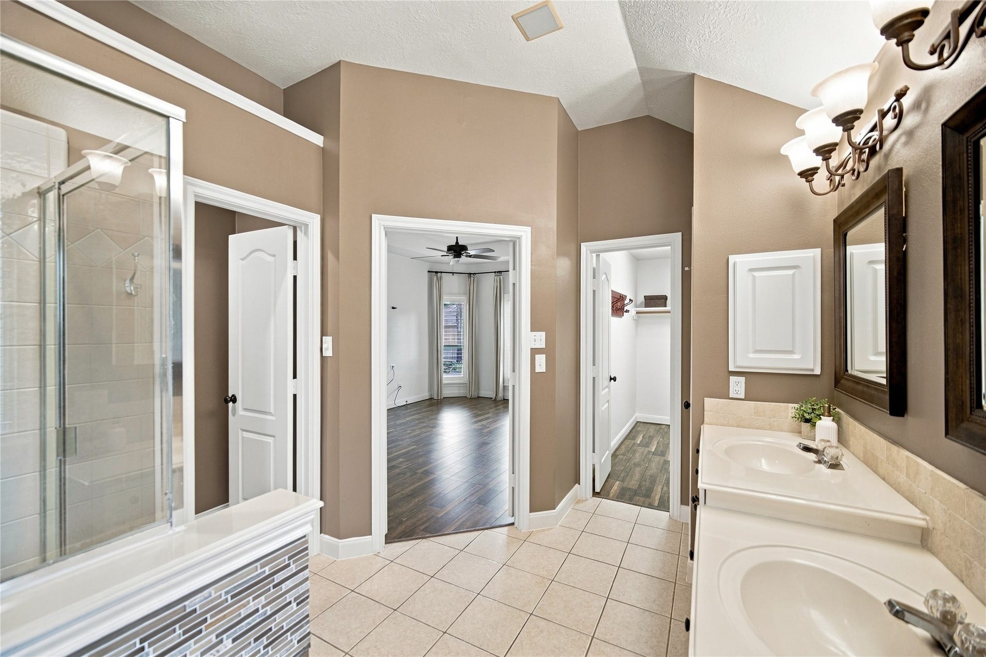23706 Indian Hills Way, Katy, TX 77494 To the right of the double-door entry is the second of the primary suite's TWO walk-in closets, along with a convenient linen closet for additional storage.
