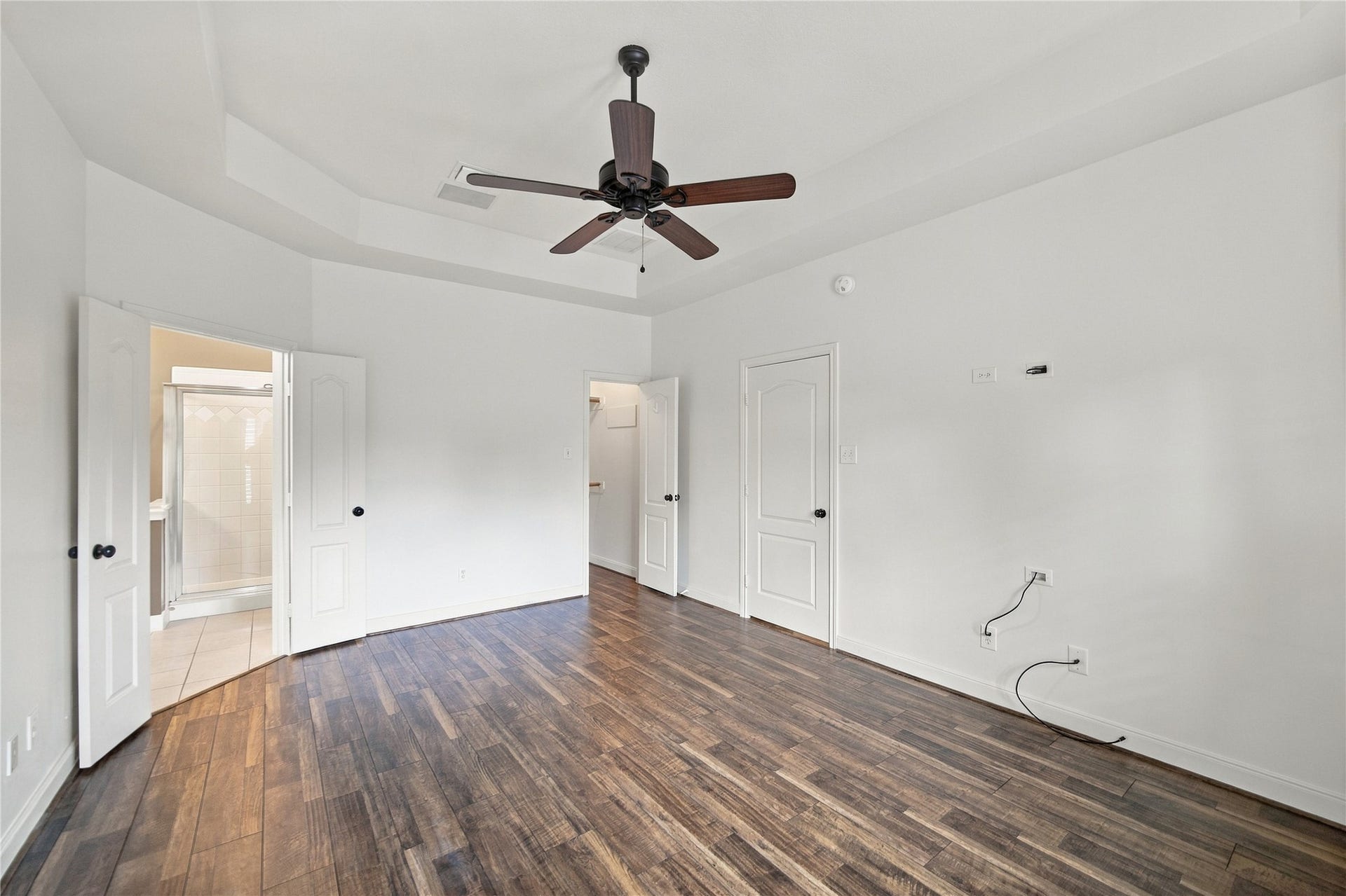 23706 Indian Hills Way, Katy, TX 77494 At left the primary suite's connecting bathroom and at right is the first of two walk-in closets.
