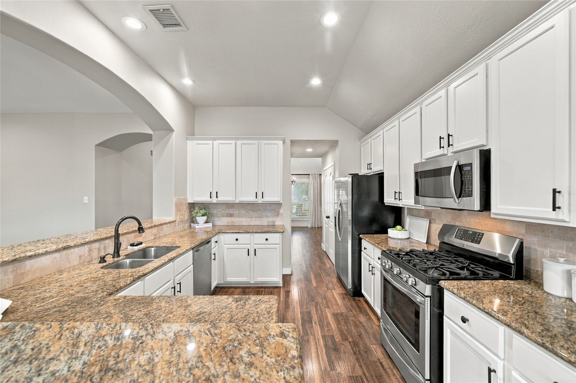 23706 Indian Hills Way, Katy, TX 77494 The stainless steel appliances include a five-burner gas range, and the double-door refrigerator is included with the home.