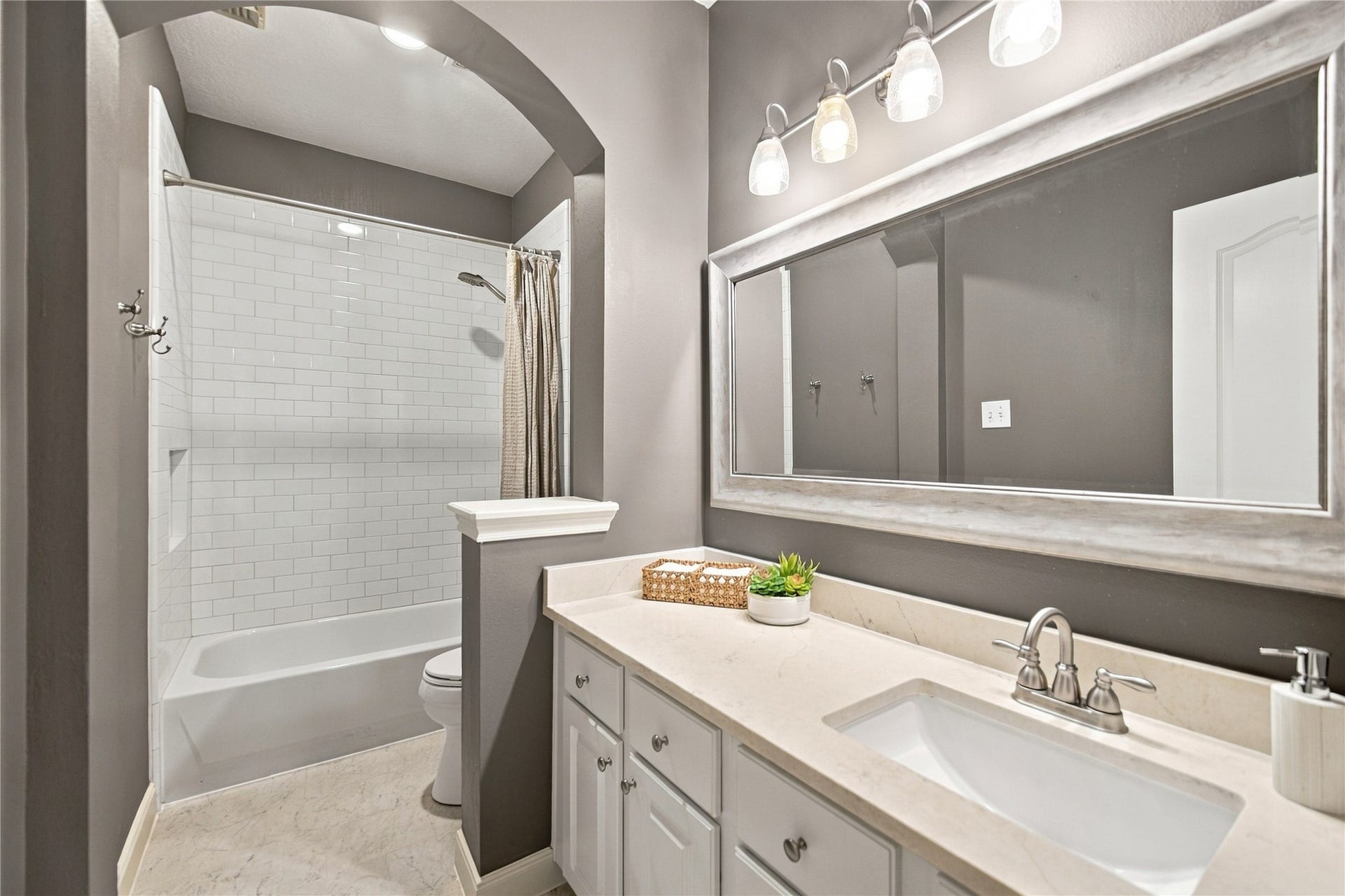 23706 Indian Hills Way, Katy, TX 77494 The well-appointed and updated second bathroom is conveniently located in the hallway near the two secondary bedrooms. Just outside the bathroom is a linen closet for additional storage.
