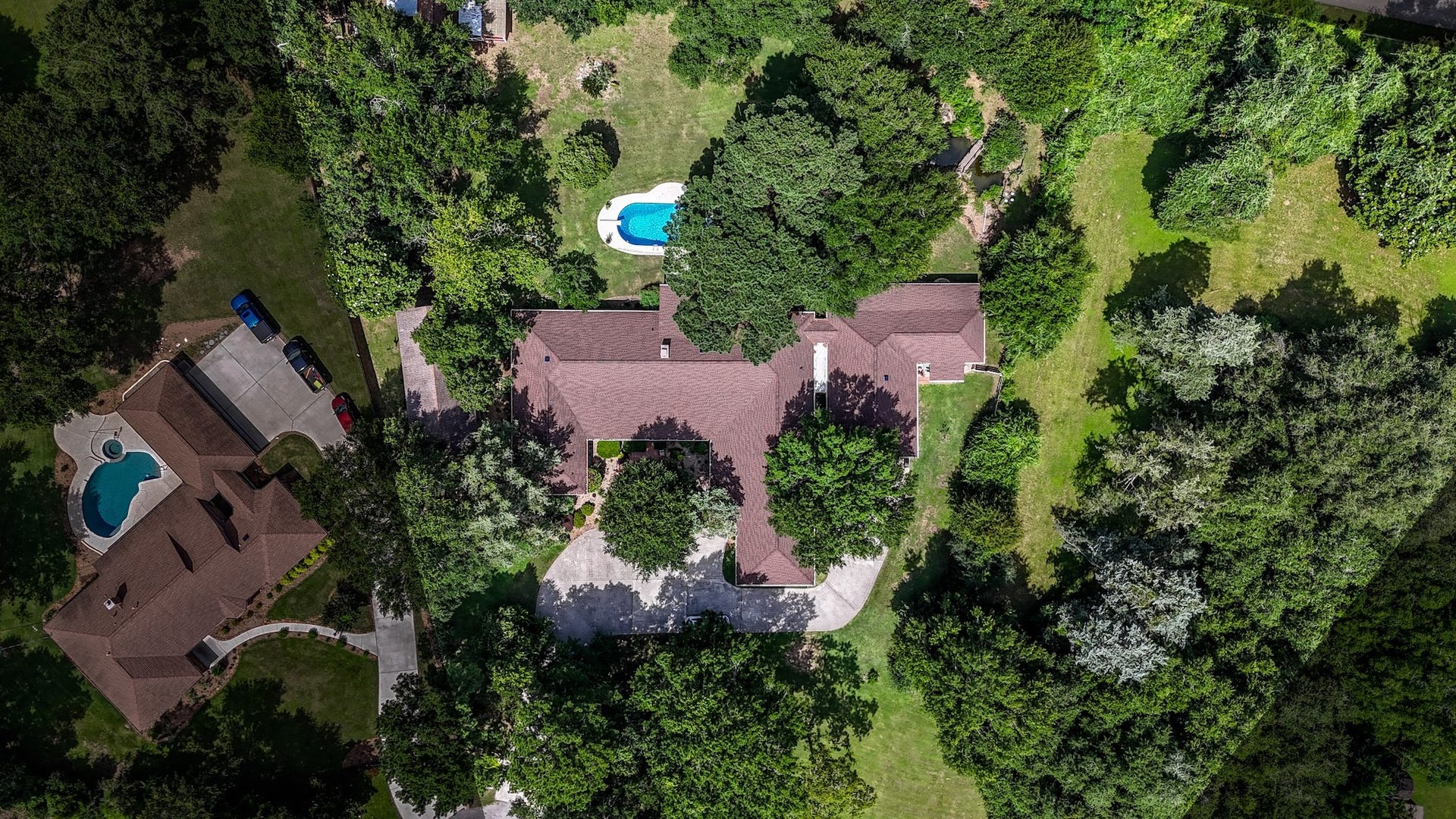 18926 Wildrose Lane, Tomball, TX 77377 A view of the back of the house and the wonderful pool.