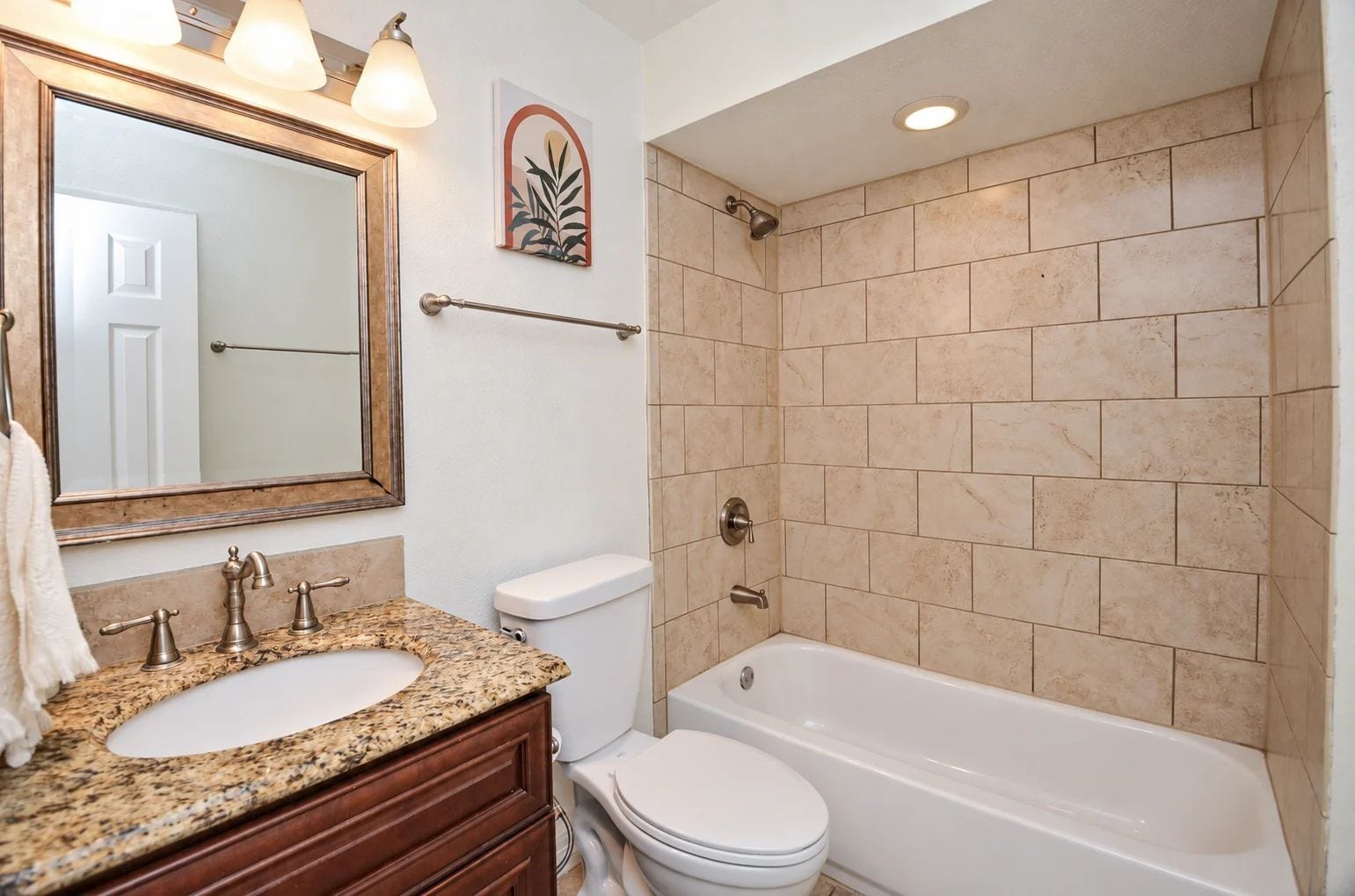5515 Saxon Drive, Houston, TX 77092 Hallway bathroom with tub/shower and brushed nickel fixtures.