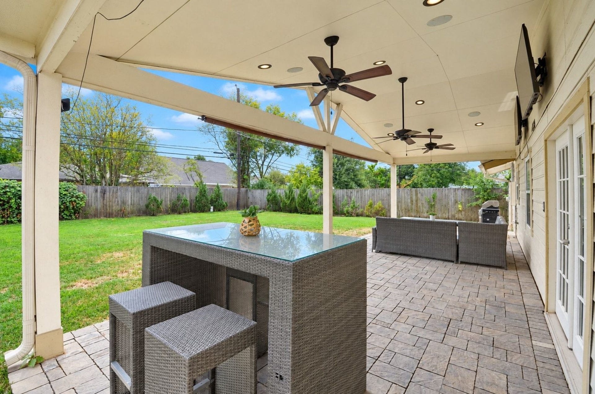 5515 Saxon Drive, Houston, TX 77092 Enjoy outdoor living on this custom covered stone patio complete with overhead ceiling fans and outdoor sound system!