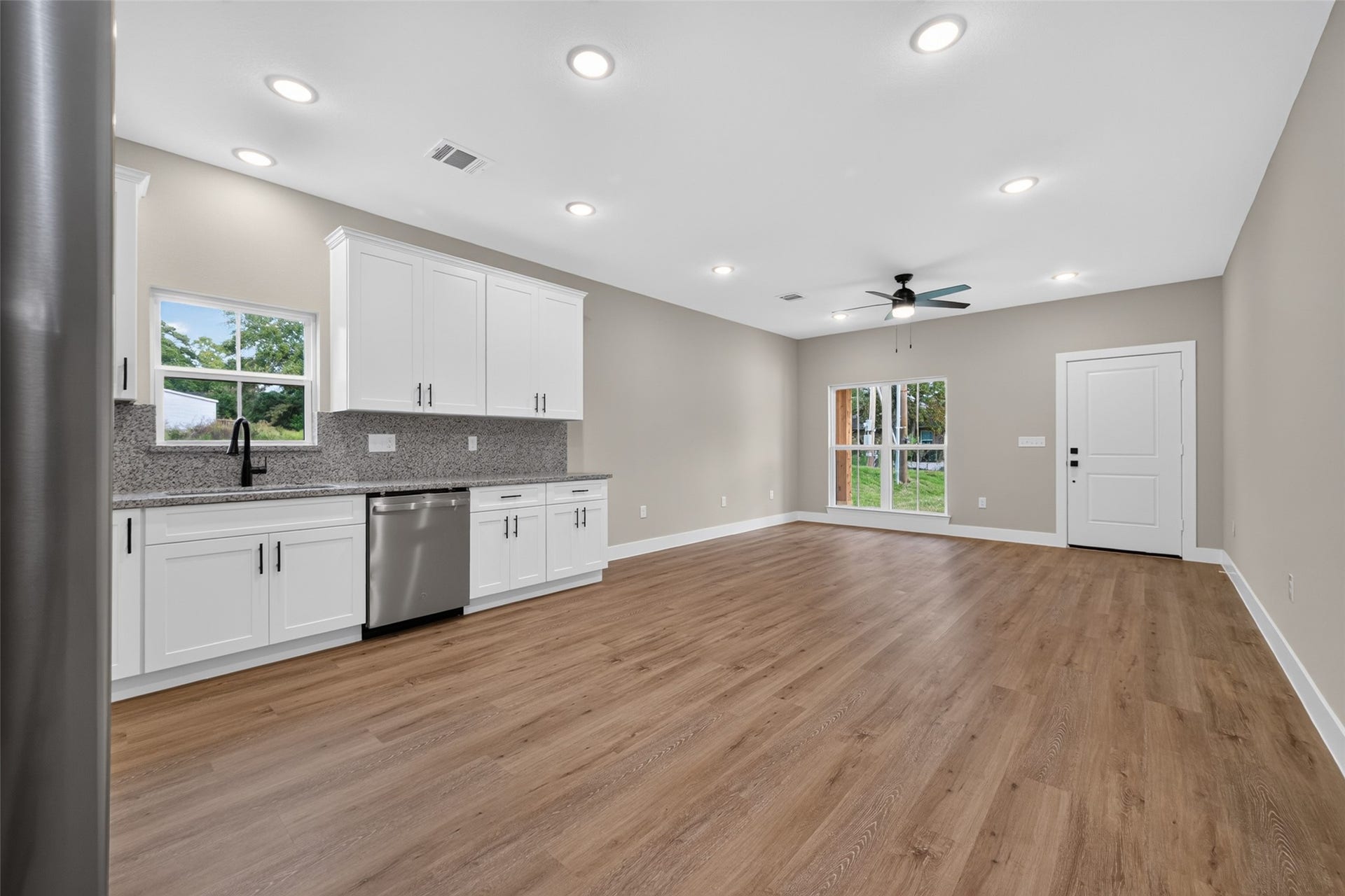1060 Mann Road, #B, Conroe, TX 77303 Open concept living, dining, and kitchen space.