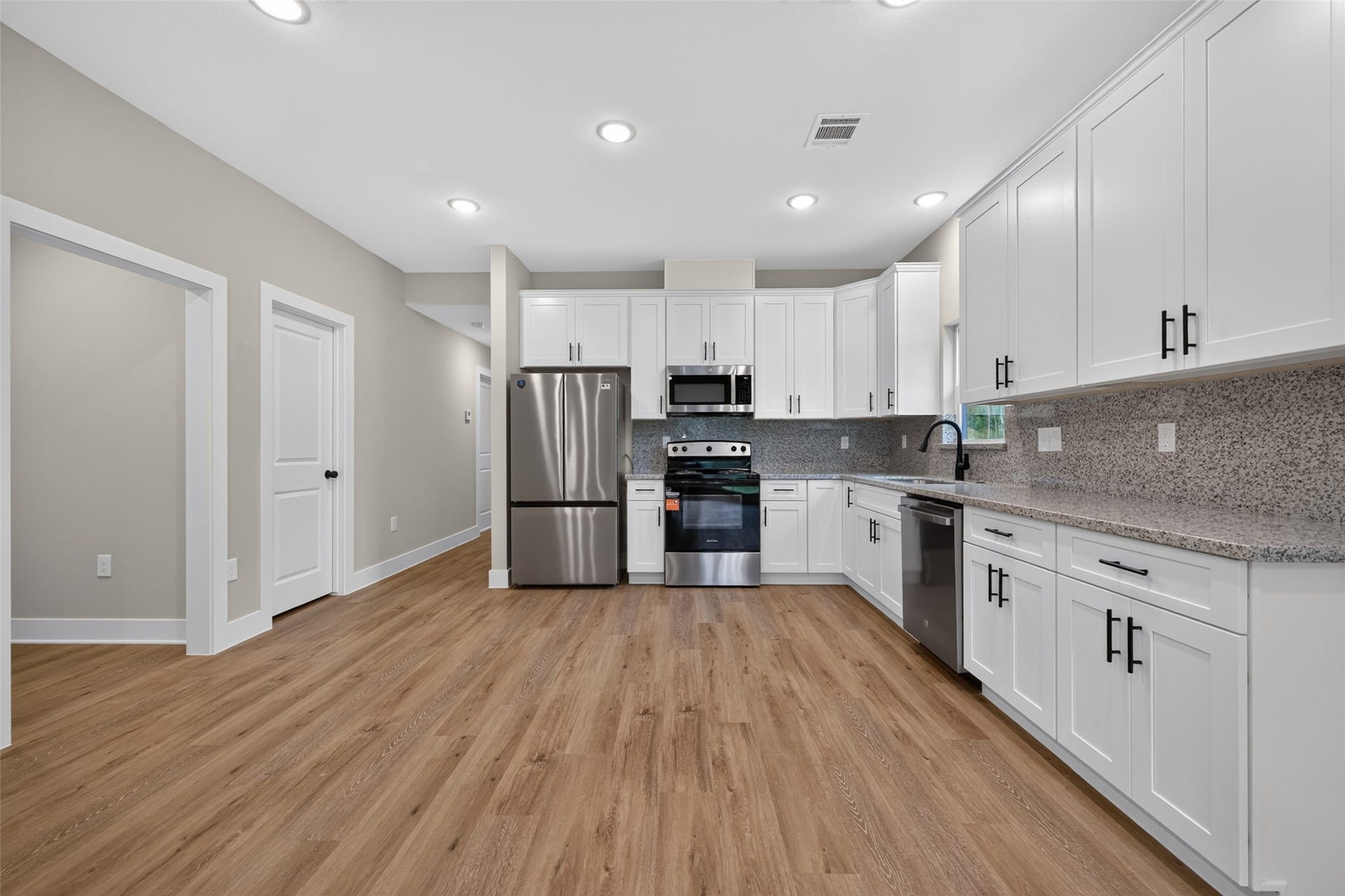 1060 Mann Road, #B, Conroe, TX 77303 Pantry and garage entrance is next to the kitchen.