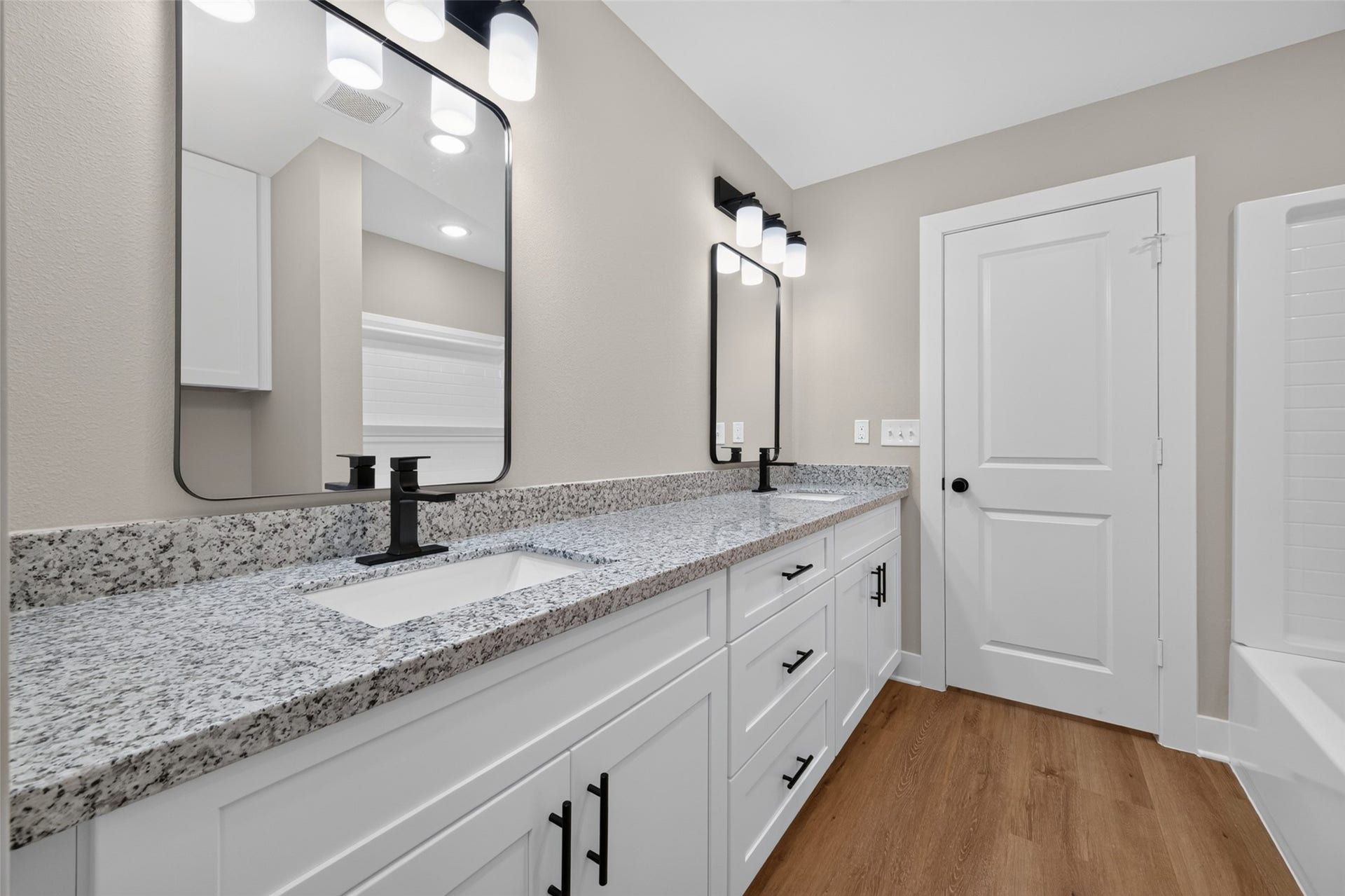 1060 Mann Road, #B, Conroe, TX 77303 Master bathroom has shower/tub combo.