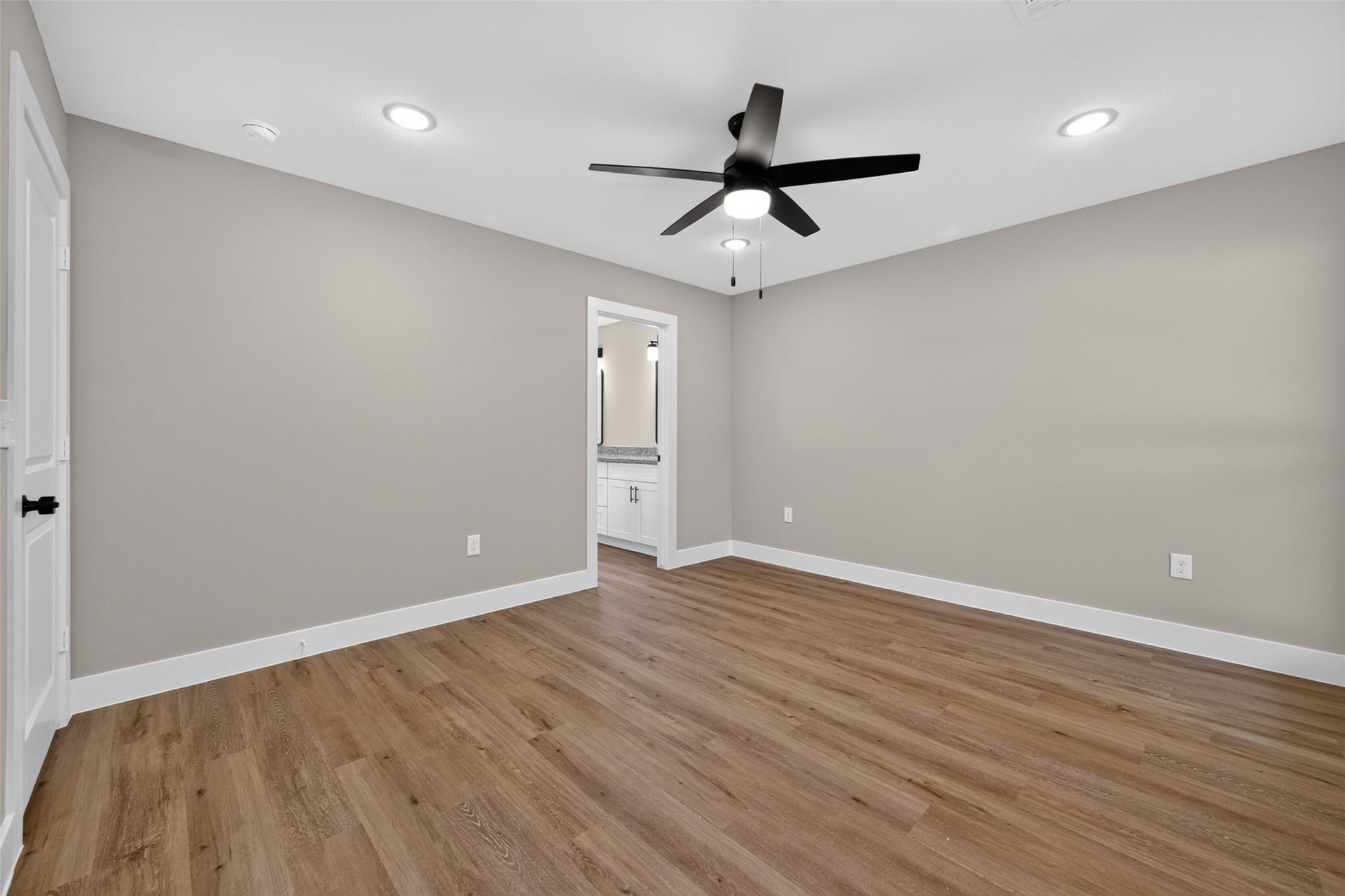 1060 Mann Road, #B, Conroe, TX 77303 Master bedroom has walk in closet and en-suite bathroom.