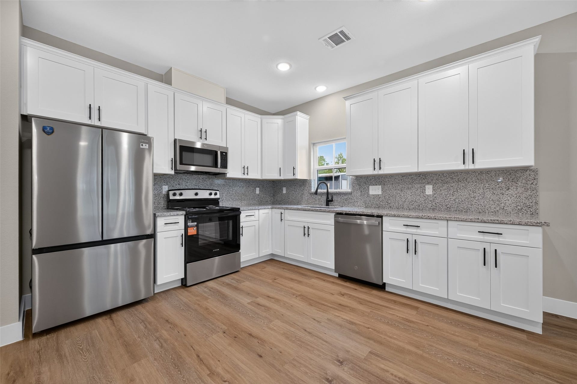 1060 Mann Road, #B, Conroe, TX 77303 Kitchen comes with brand new refrigerator.