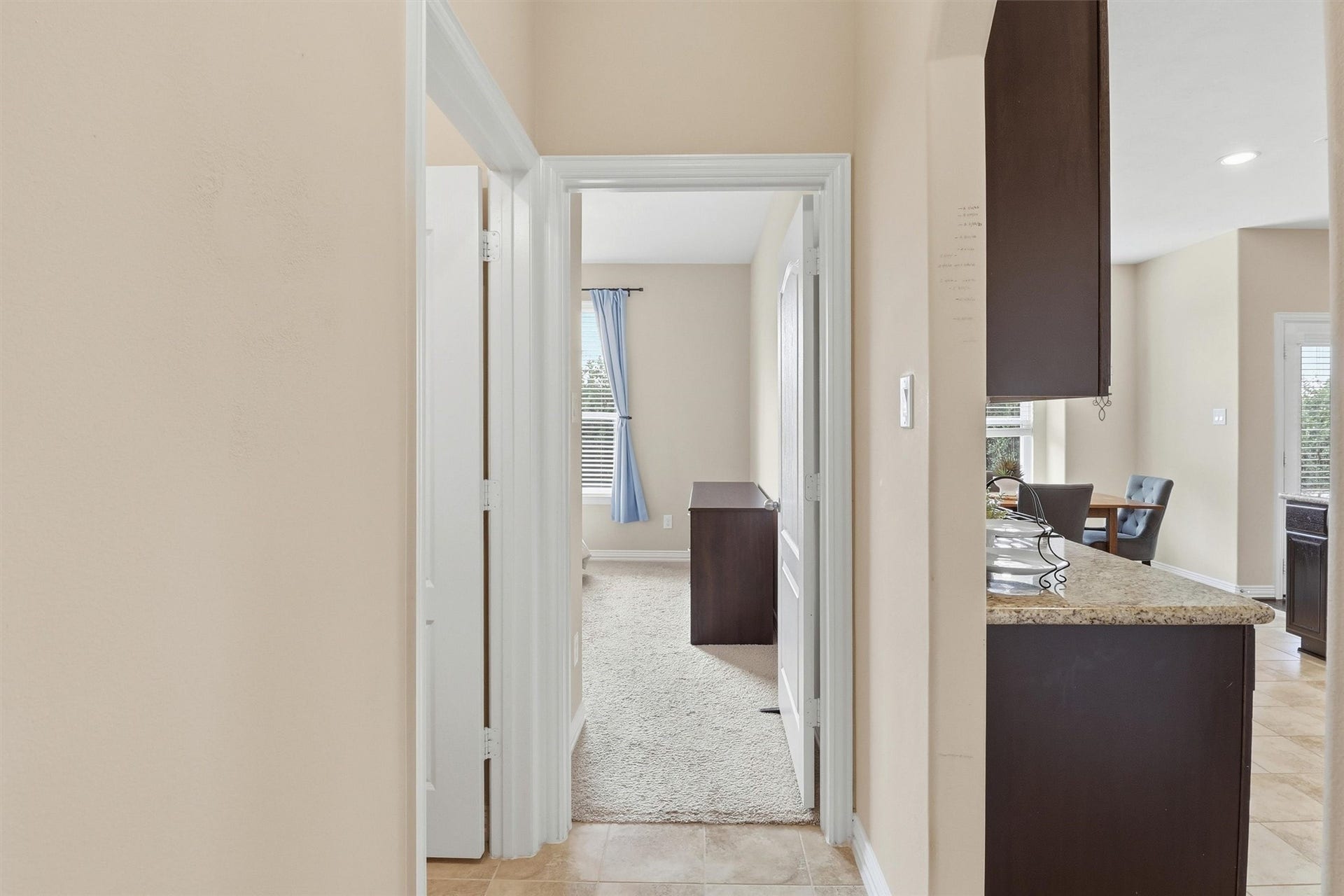 3219 Cotton Ranch Drive, Katy, TX 77494 The private hallway creates separation between the secondary bedroom and the living spaces while enhancing the thoughtful floor plan.