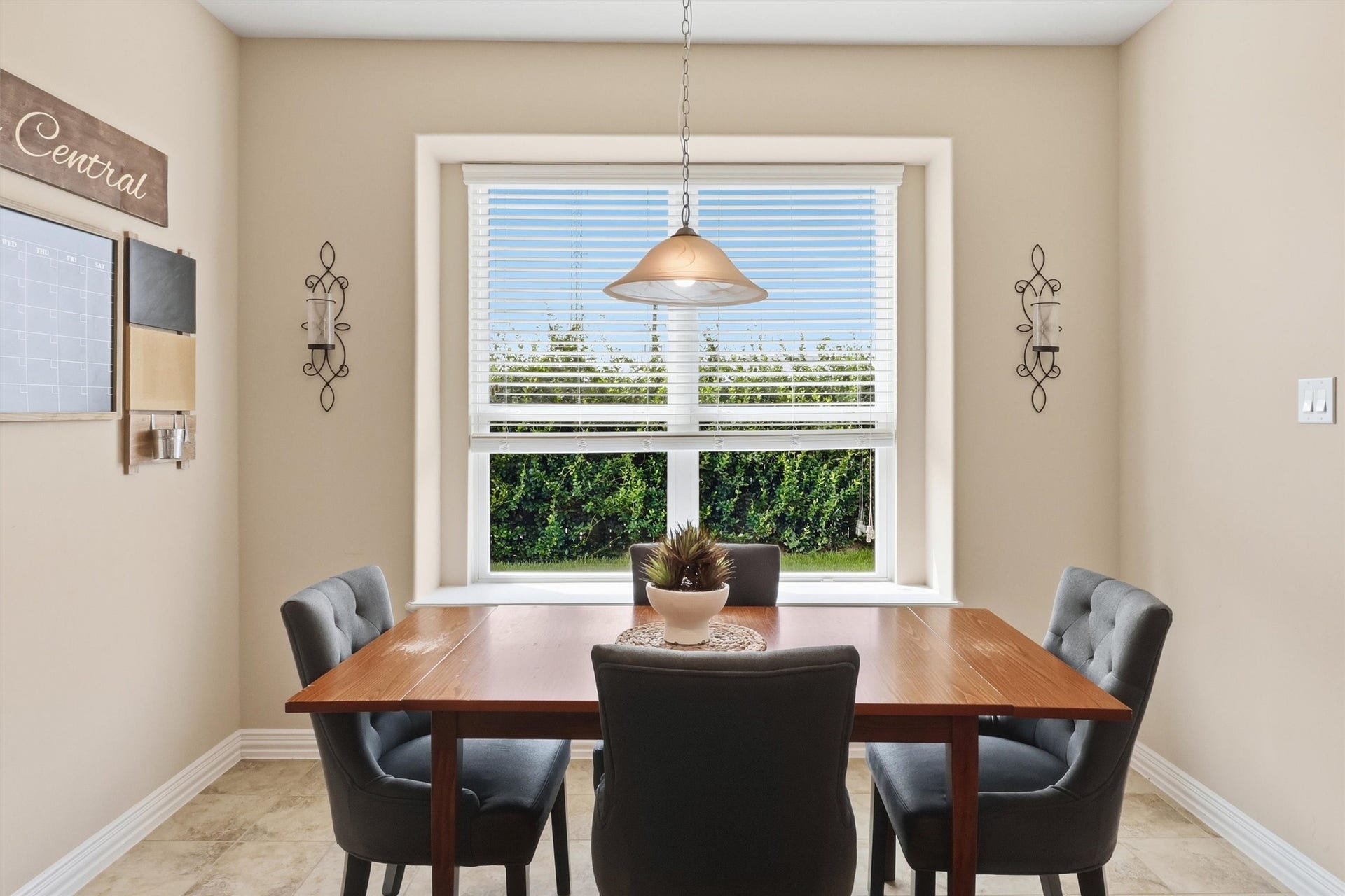 3219 Cotton Ranch Drive, Katy, TX 77494 Natural light fills the adjoining breakfast area, creating a bright and inviting setting for casual dining. A large picture window overlooks the backyard, while a nearby glass door provides convenient access to the covered patio for seamless indoor-outdoor living.