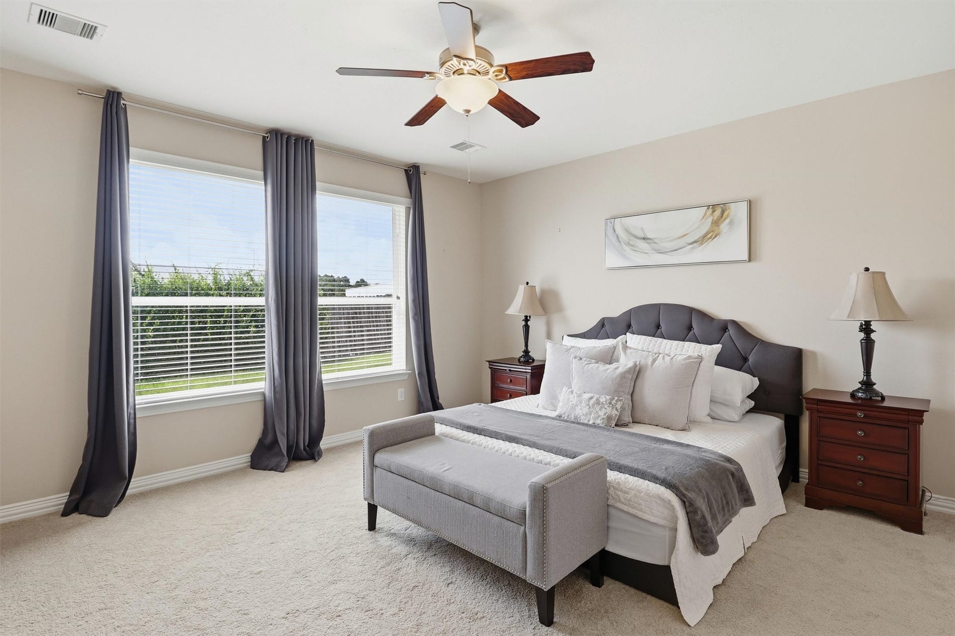 3219 Cotton Ranch Drive, Katy, TX 77494 Privately tucked away on the main level, the spacious primary suite offers a peaceful escape designed for comfort and relaxation.