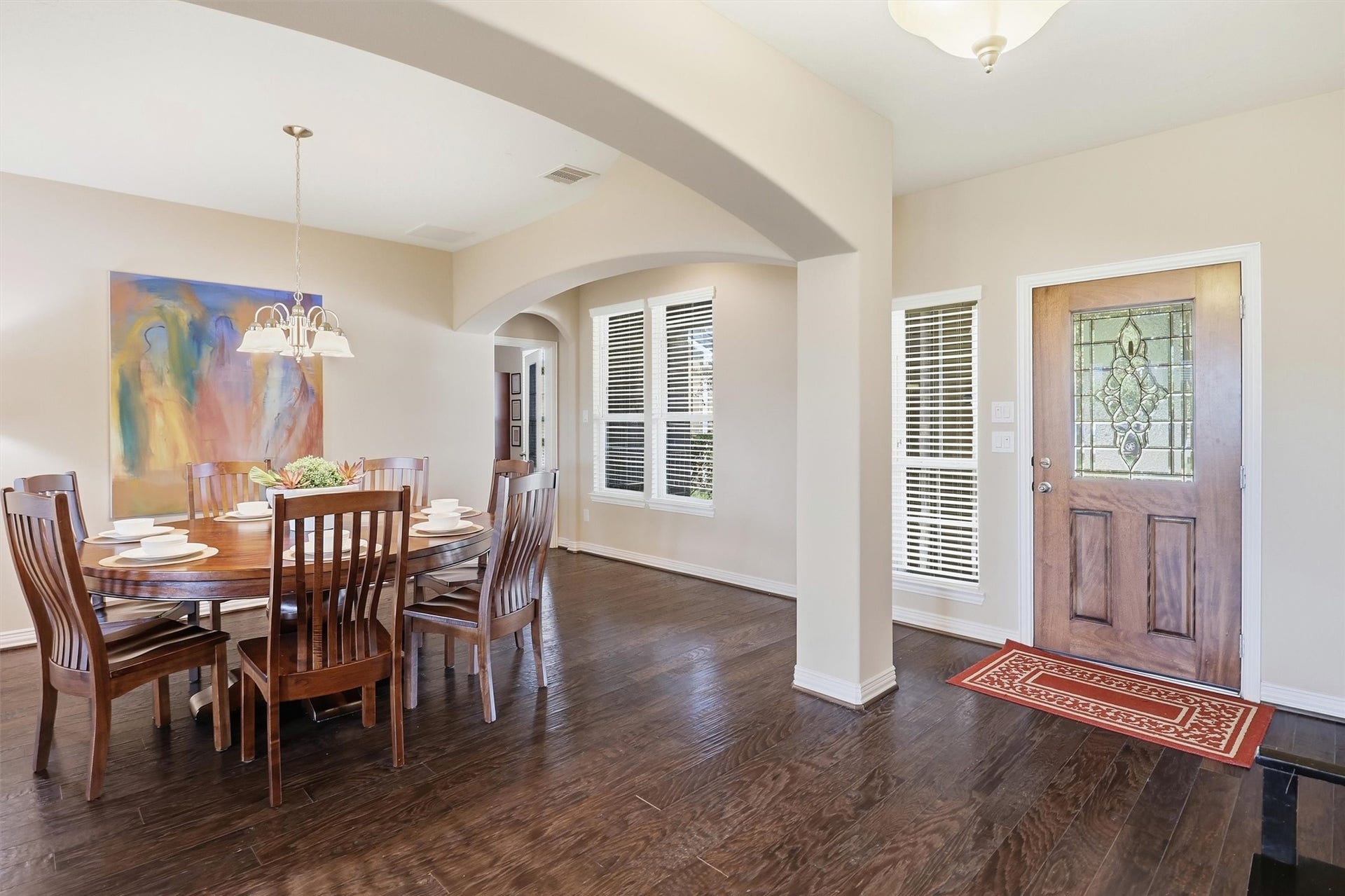 3219 Cotton Ranch Drive, Katy, TX 77494 Step inside to a bright, inviting entry where rich wood flooring, soaring ceilings, graceful archways, and abundant natural light introduce the home's open and thoughtfully designed layout.