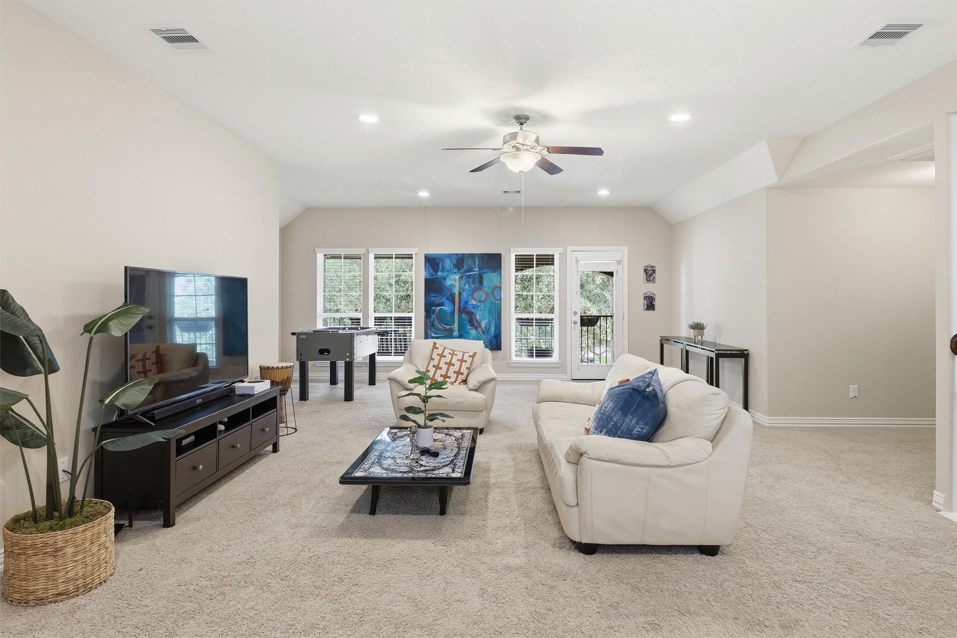 3219 Cotton Ranch Drive, Katy, TX 77494 Designed with flexibility & comfort in mind, the expansive upstairs game room offers an impressive amount of living space with plush carpeting, soaring ceilings, recessed lighting, & a ceiling fan for year-round comfort.