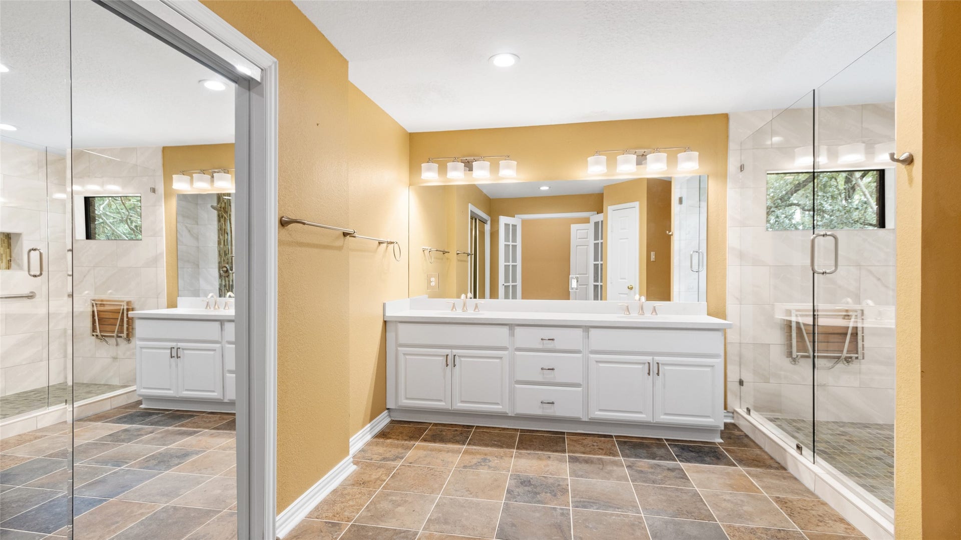 97 Avenue J, Dickinson, TX 77539 Primary bath has double vanities and walk in shower.