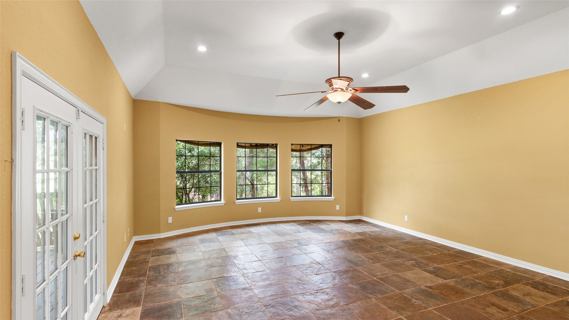 97 Avenue J, Dickinson, TX 77539 Huge primary bedroom with breathtaking waterfront views and private access to the deck.