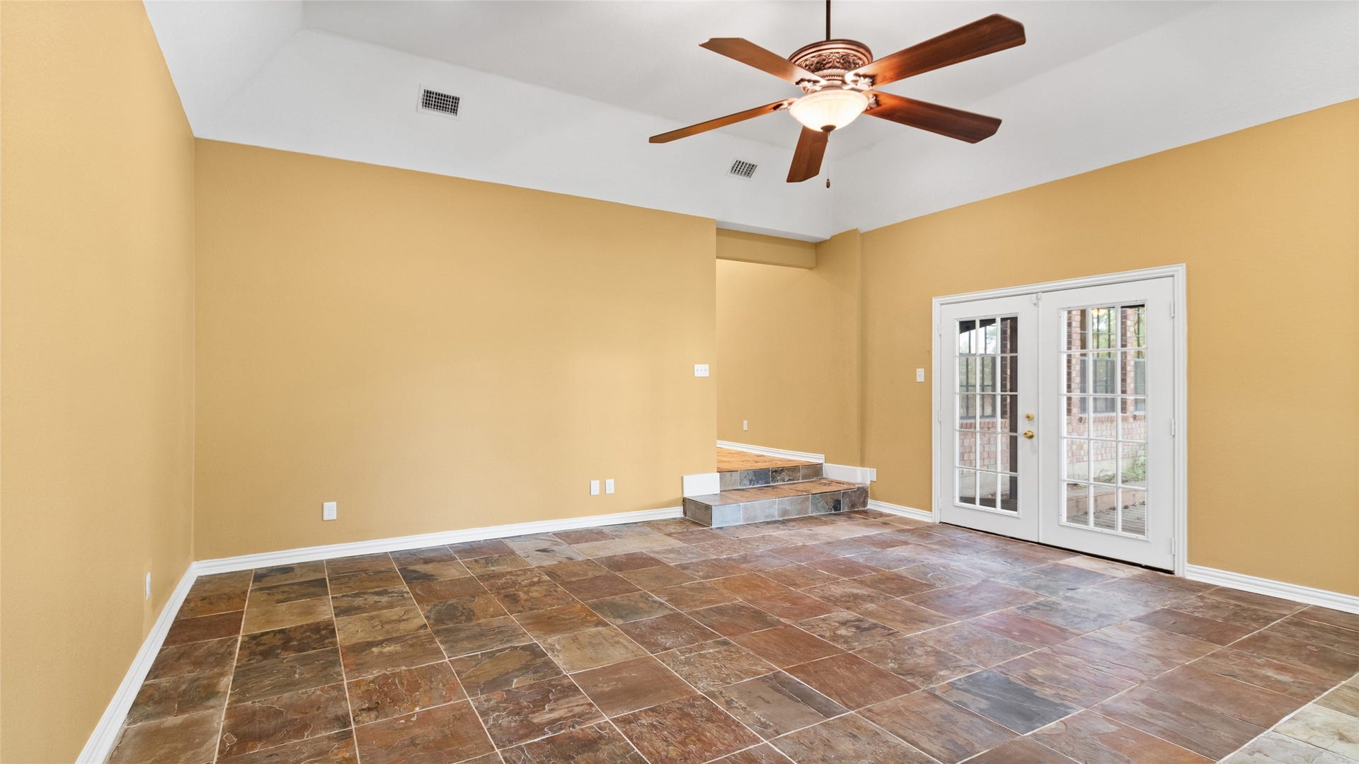 97 Avenue J, Dickinson, TX 77539 Huge primary bedroom with breathtaking waterfront views and private access to the deck.