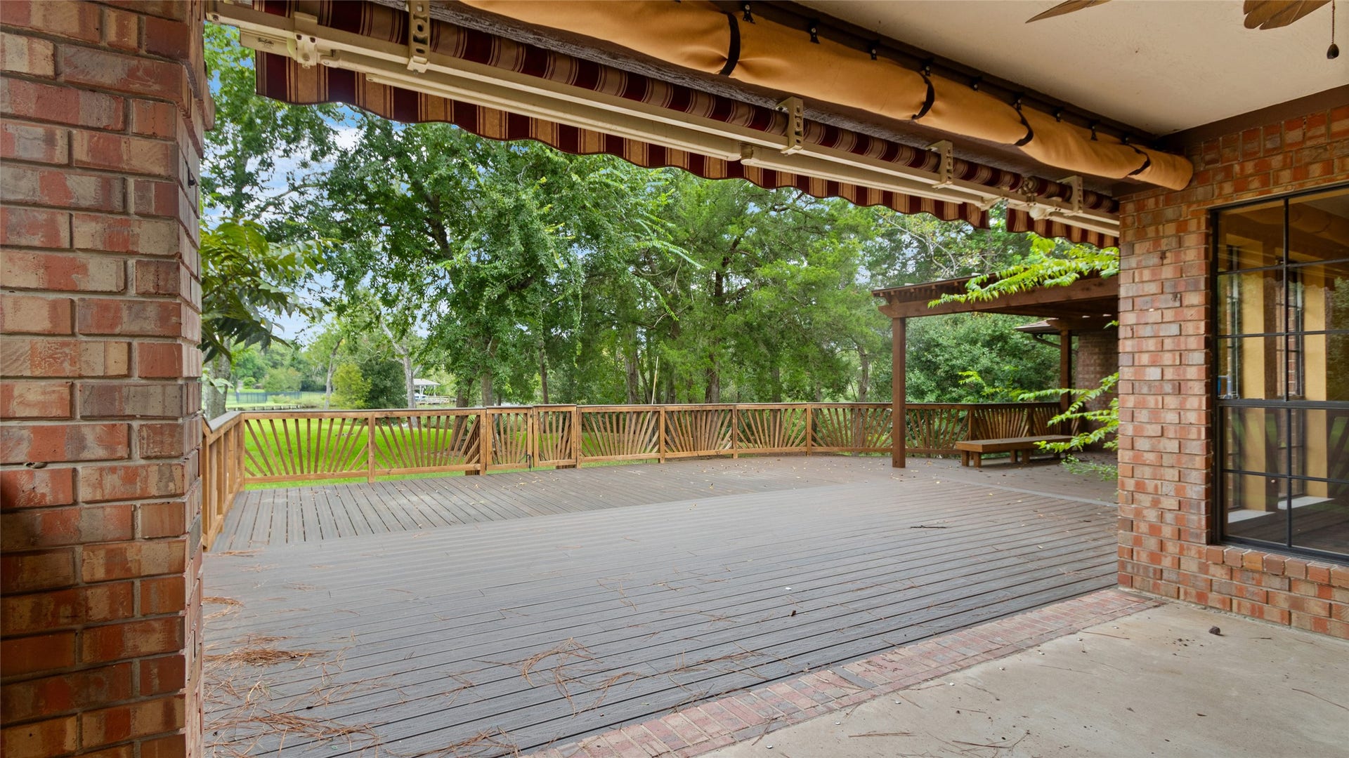 97 Avenue J, Dickinson, TX 77539 Covered patio and outdoor deck - this backyard is perfect for entertaining!