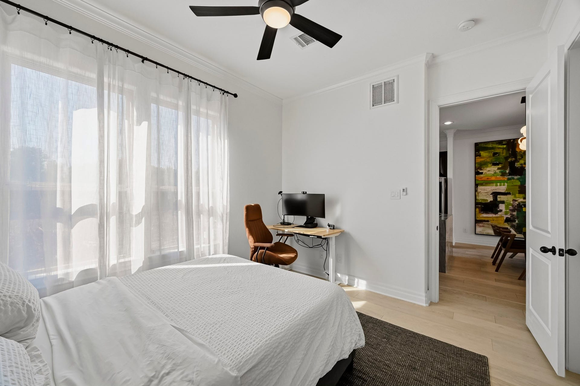 11009 Upland Forest Drive, Houston, TX 77043 Bright and airy bedroom featuring large windows .