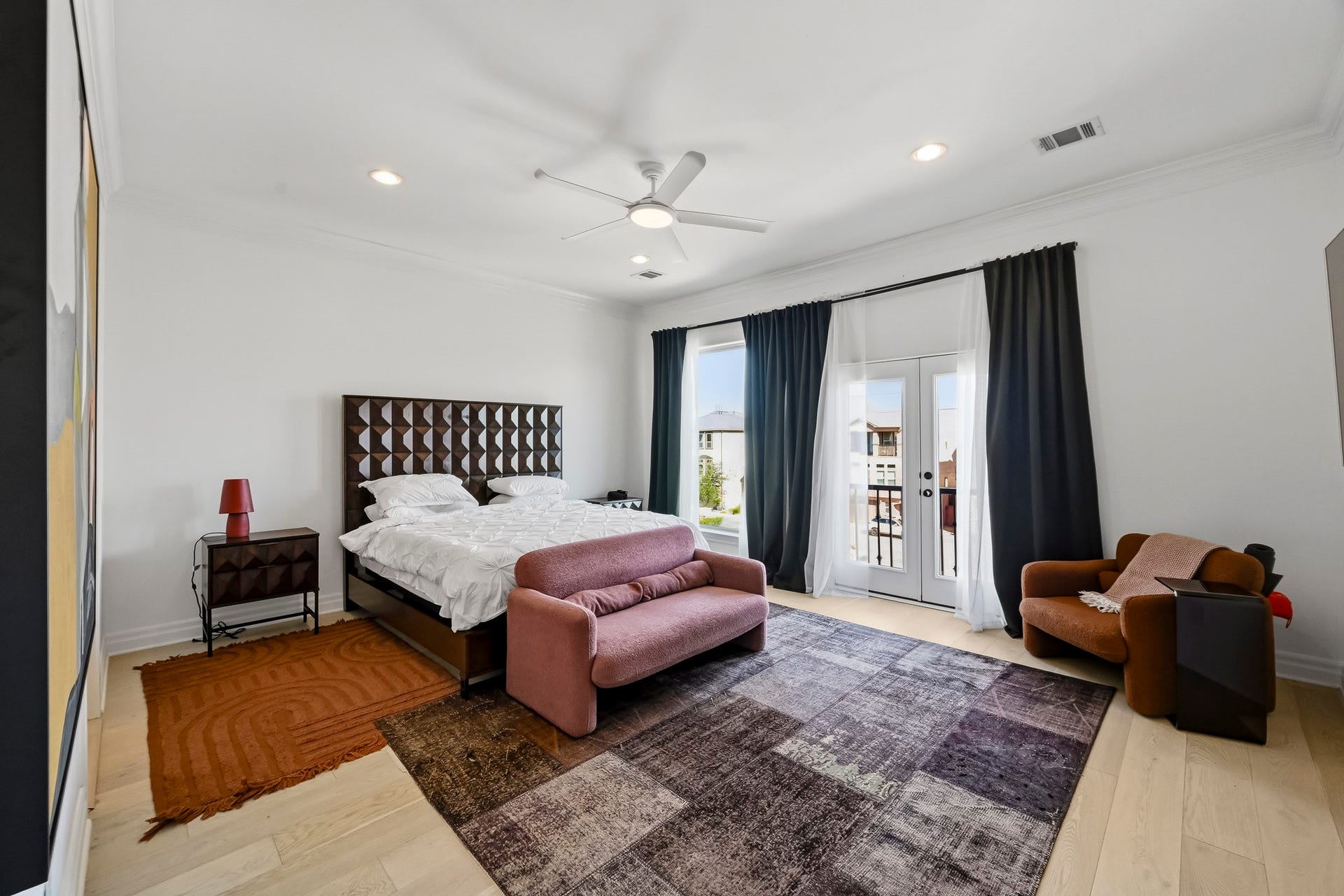 11009 Upland Forest Drive, Houston, TX 77043 Spacious bedroom featuring elegant French doors leading to a private balcony.