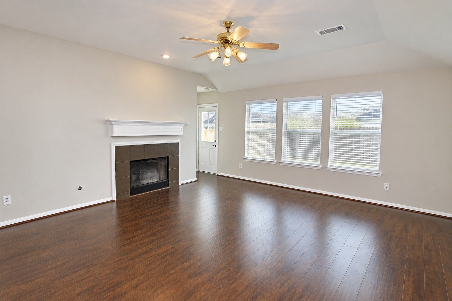 3111 Stratford Bend Drive, Sugar Land, TX 77498 Living room with cozy fireplace - "Home is occupied"