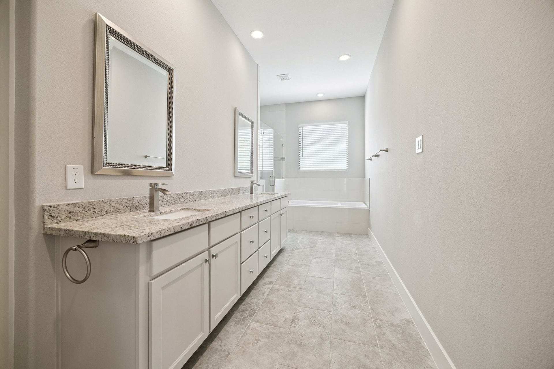608 W 28th Street, #B, Houston, TX 77008 FINALLY! Now this is how a PRIMARY BATH should feel! NEWLY Renovated (10/2026) - the sprawling dual sink marble vanity boasts to rectangular under mounted porcelain sinks, endless counter space and cabinets and drawers! Private Toilet Closet, 2 HUGE walk-in closets, large soaking tub & oversized step-in shower! Welcome to your new lavish bath retreat! NICE!