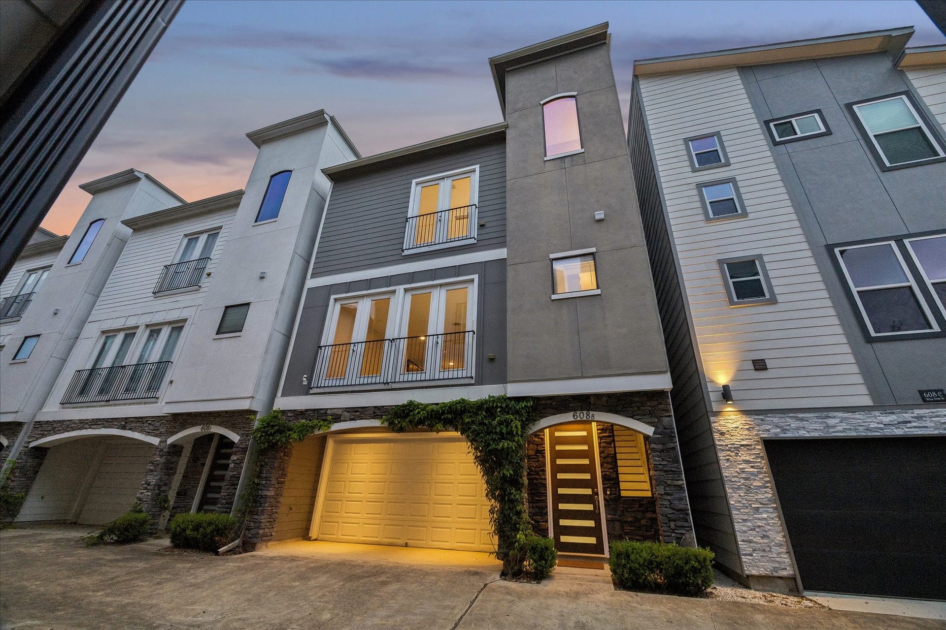 608 W 28th Street, #B, Houston, TX 77008 Recently built (2019) This freestanding GATED Home boasts stylish modern design, large double pane windows & 4 outdoor areas! Stone & stucco construction & elegant landscaping featuring hearty green Wisteria and Japanese Boxwoods! Rare exterior spaces include a covered porch, porte-cochere, Juliet balconies, a nice second story covered porch off the kitchen (ideal for grilling) & stunning roof top terrace offering extraordinary sunset & starlight views! NO HOA Fees, yay!