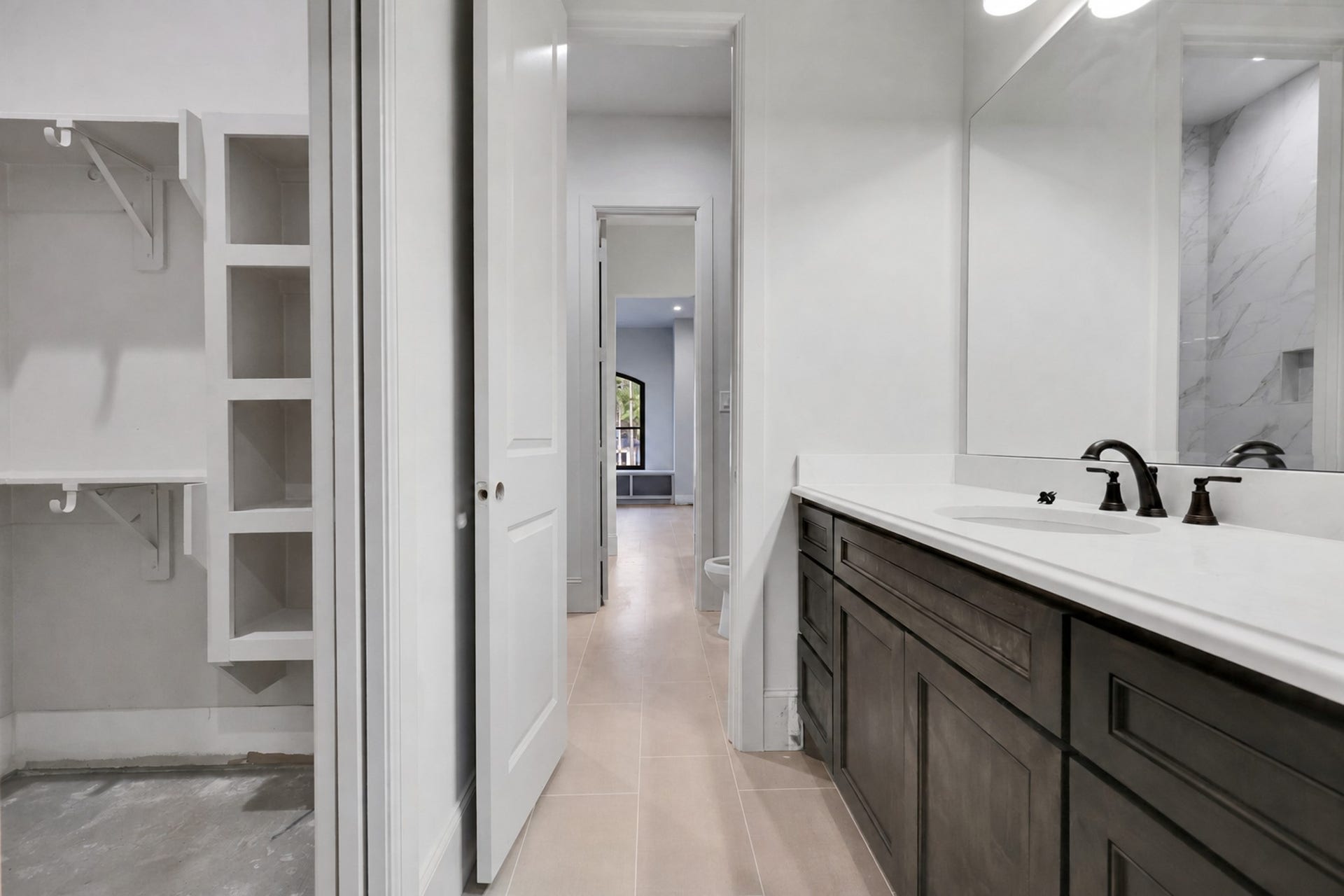 25083 Chisos Bend, Montgomery, TX 77316 Jack and Jill bath for bedroom 3 with view of closet with a pocket door