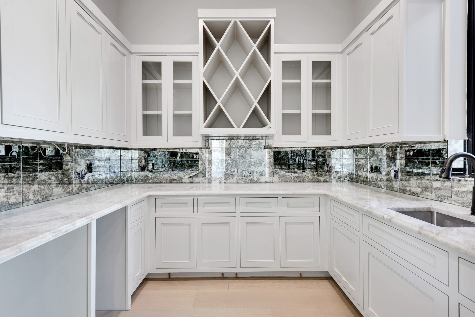 25083 Chisos Bend, Montgomery, TX 77316 Butlers pantry with a wine rack and extra sink. Cut outs to the left will contain a mini fridge and ice maker