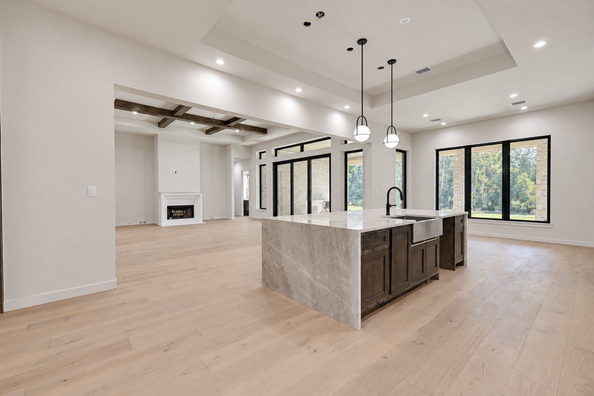 25083 Chisos Bend, Montgomery, TX 77316 Waterfall island in the kitchen with alder stained wood and a farm style sink