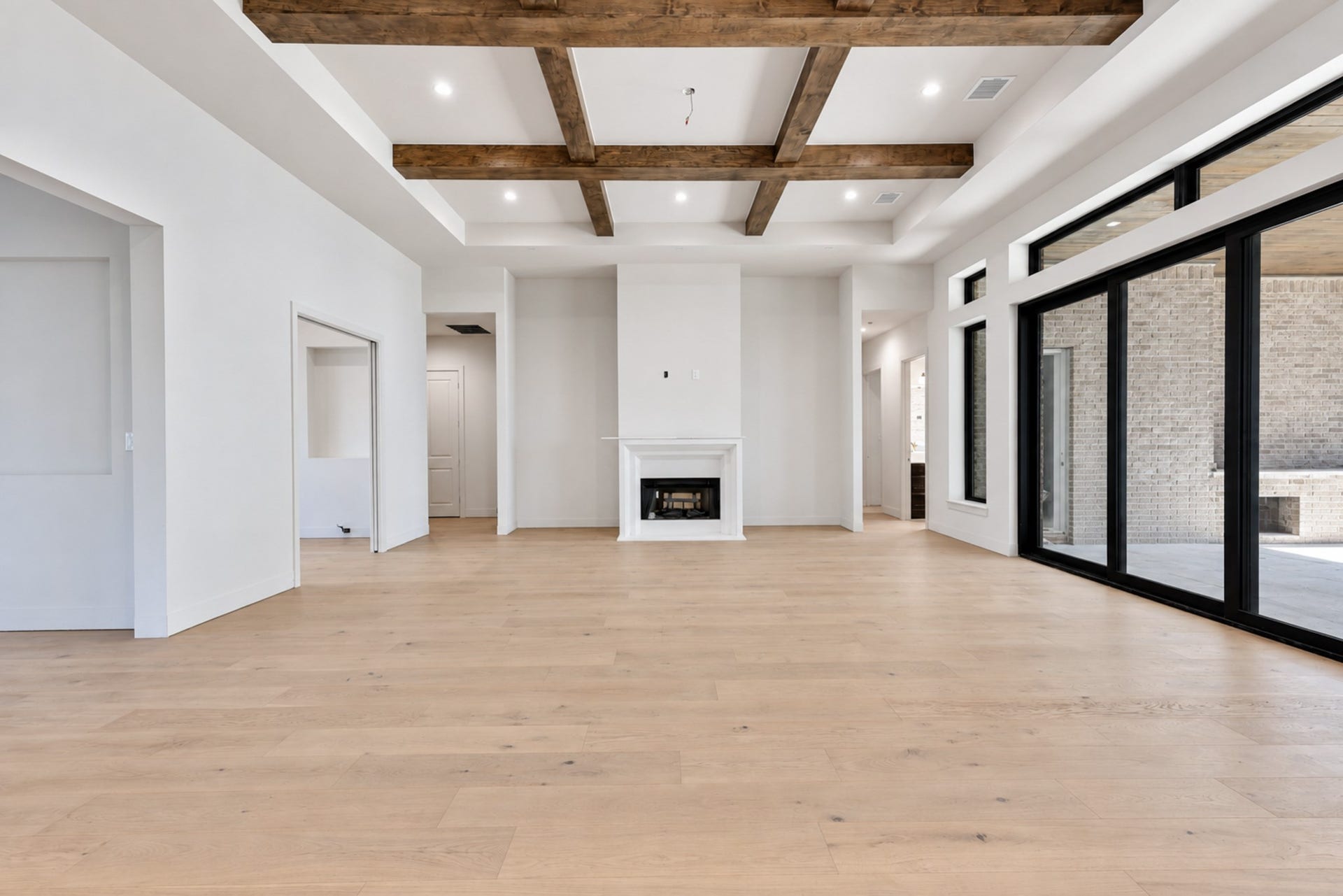25083 Chisos Bend, Montgomery, TX 77316 Full view of family room with the office and two bedrooms to the left of the fireplace and another bedroom and pool bath to the right