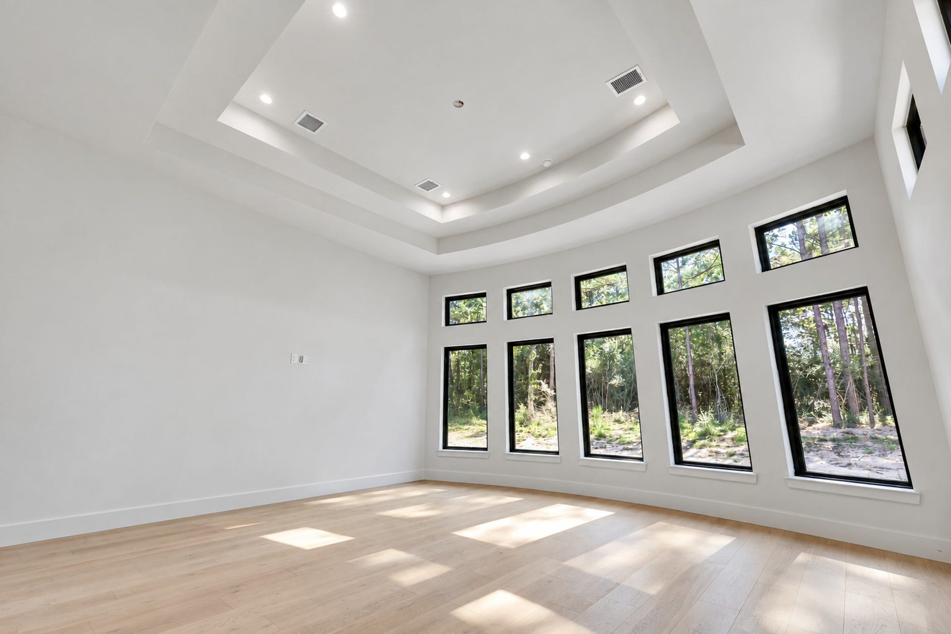 25083 Chisos Bend, Montgomery, TX 77316 Primary bedroom is accented tray ceilings and plentiful natural lighting from the bay windows and radius wall