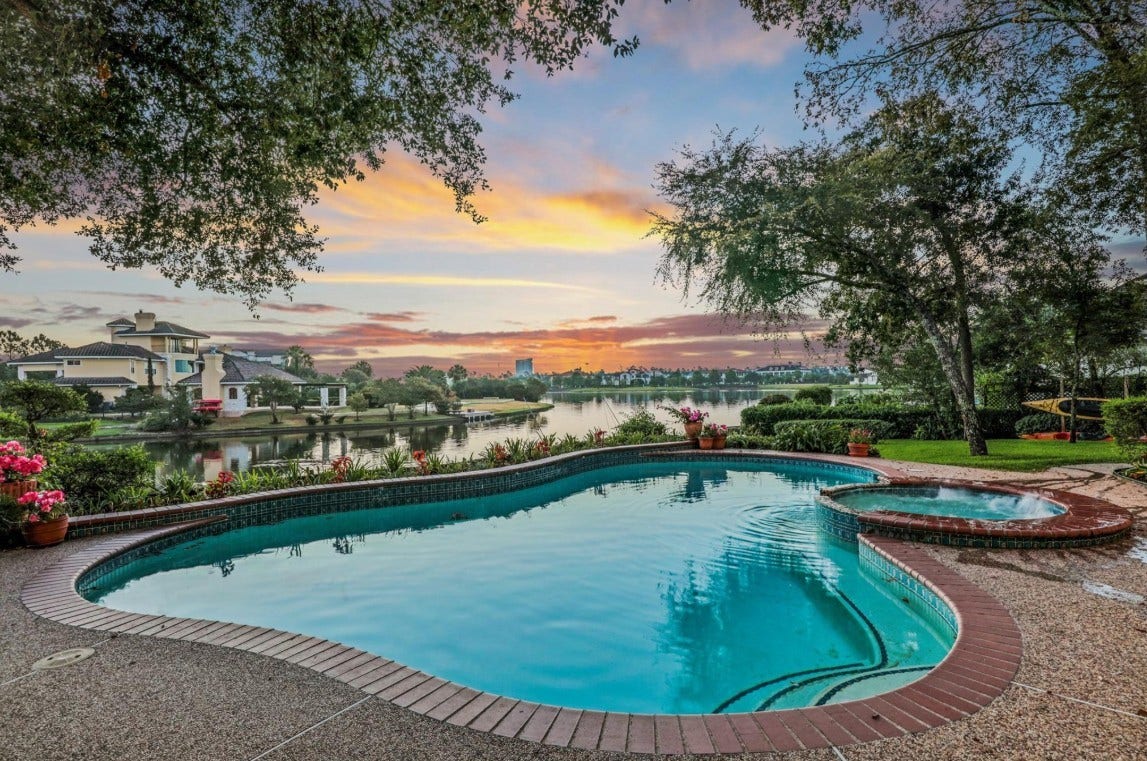 35 W Isle Place, The Woodlands, TX 77381 Resort-style swimming pool overlooking the water, perfect for entertaining and relaxing.