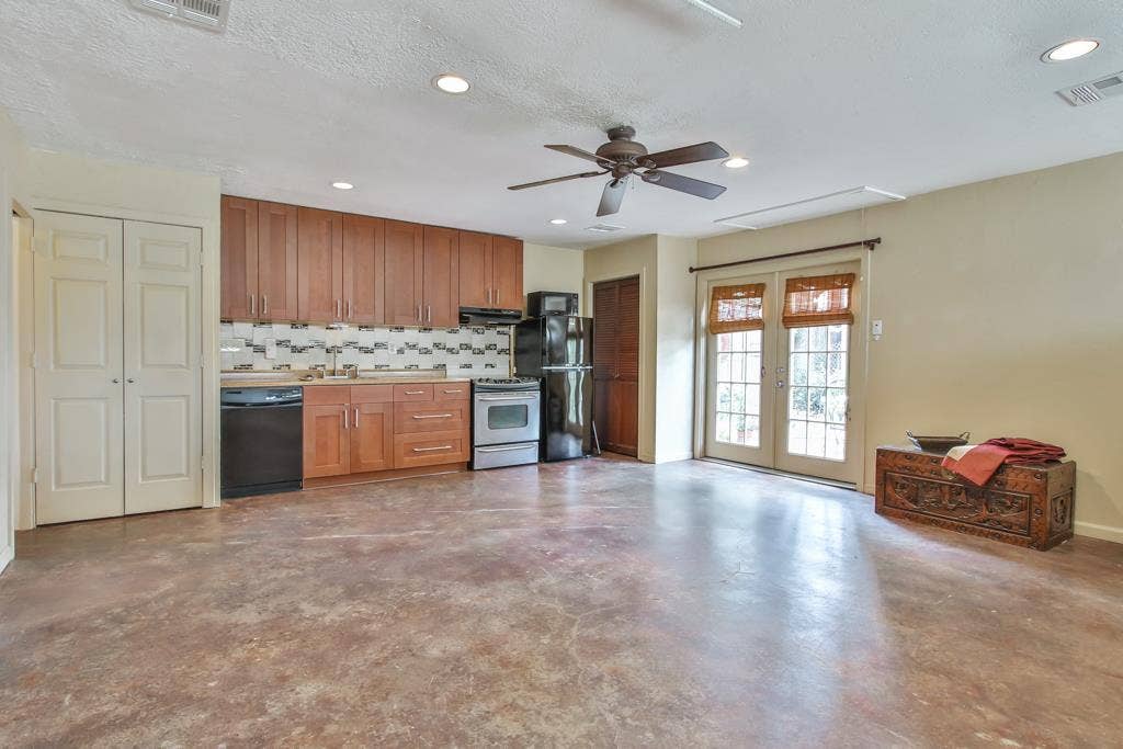 5402 Imogene Street, Houston, TX 77096 Large living and dining area. Polished concrete floors with full kitchen and washer dryer in closet next to dishwasher.