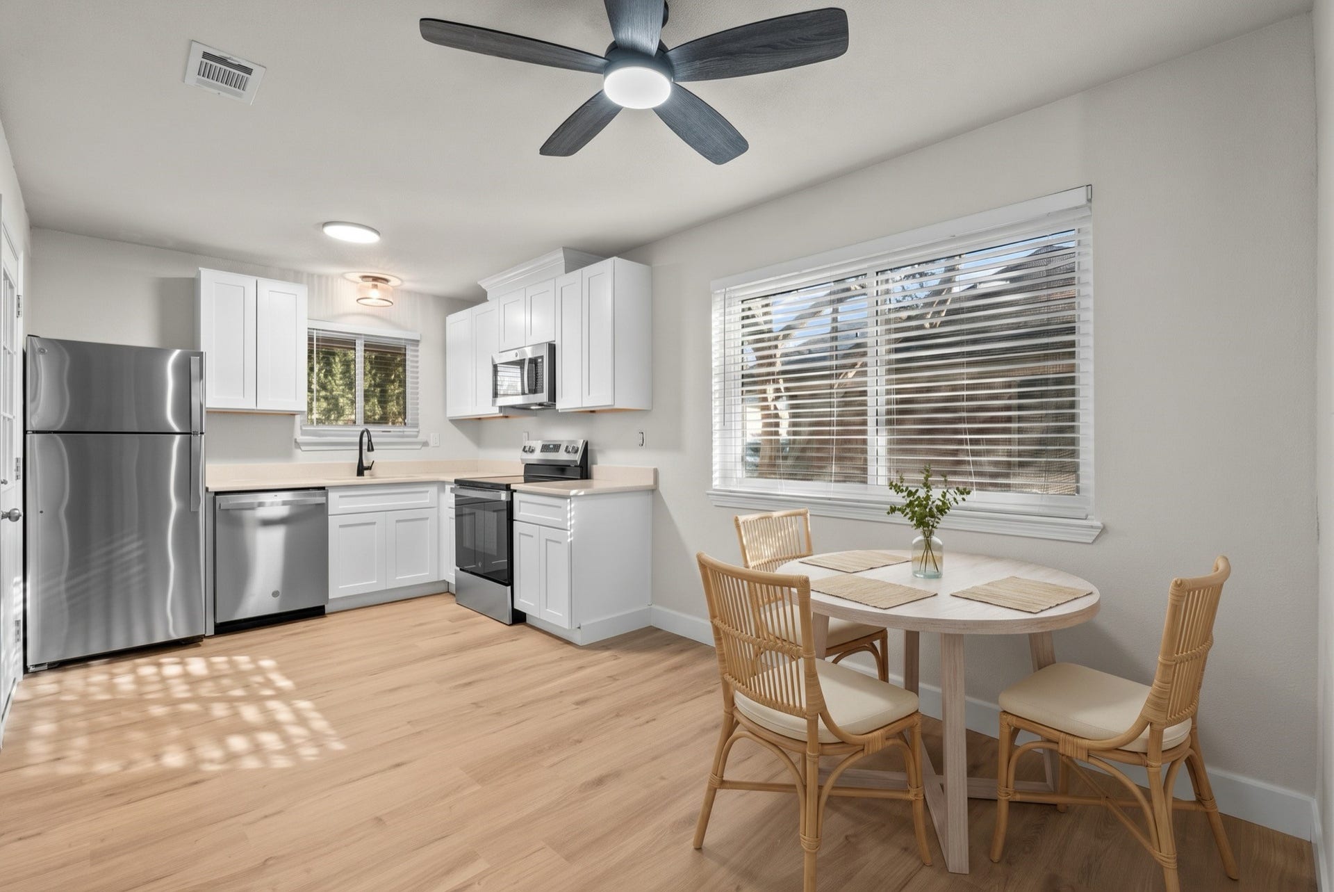 Enjoy casual meals and easy hosting with this open dining nook located just steps from the kitchen.