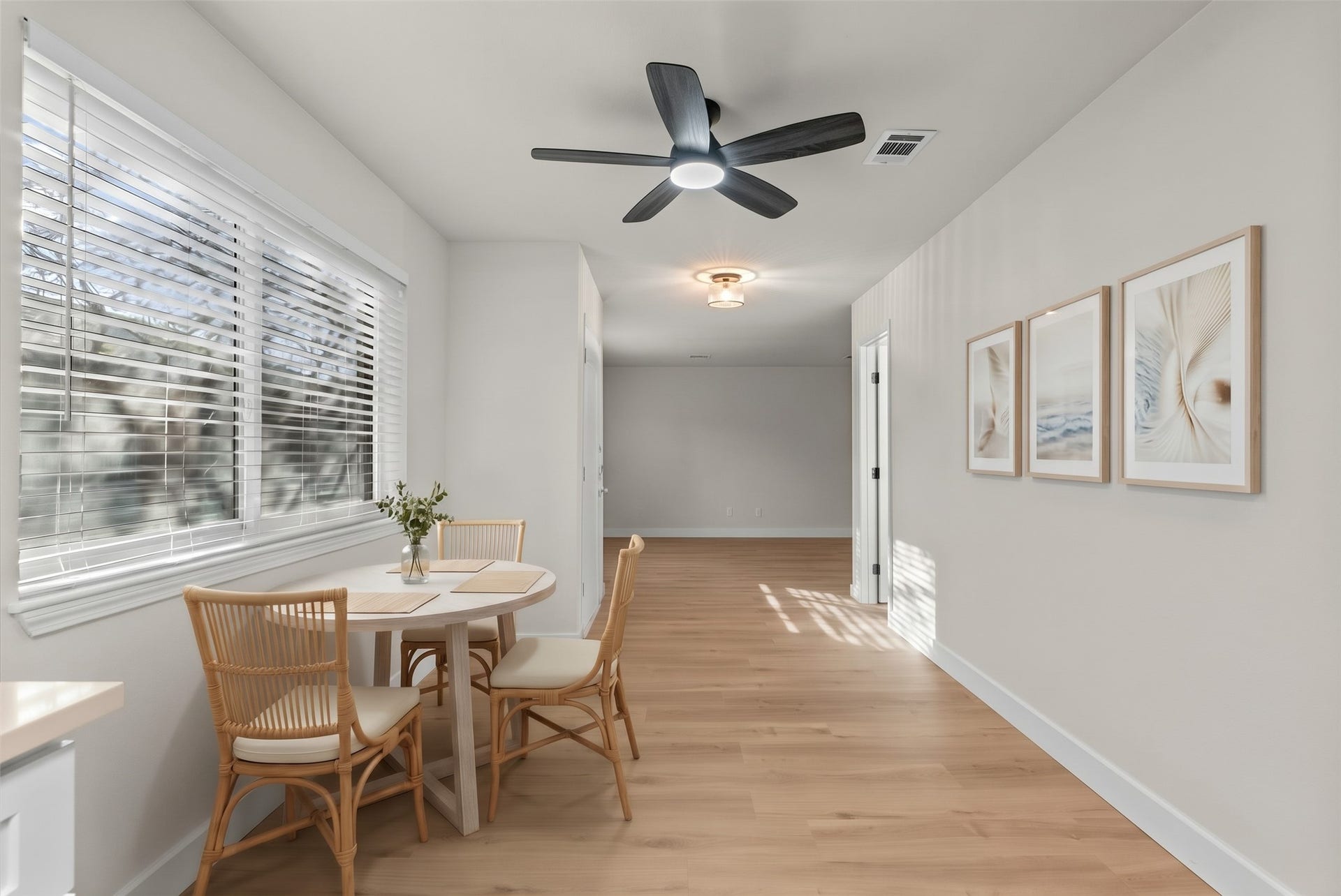Continuous vinyl plank flooring creates a seamless, cohesive flow across the main living areas.