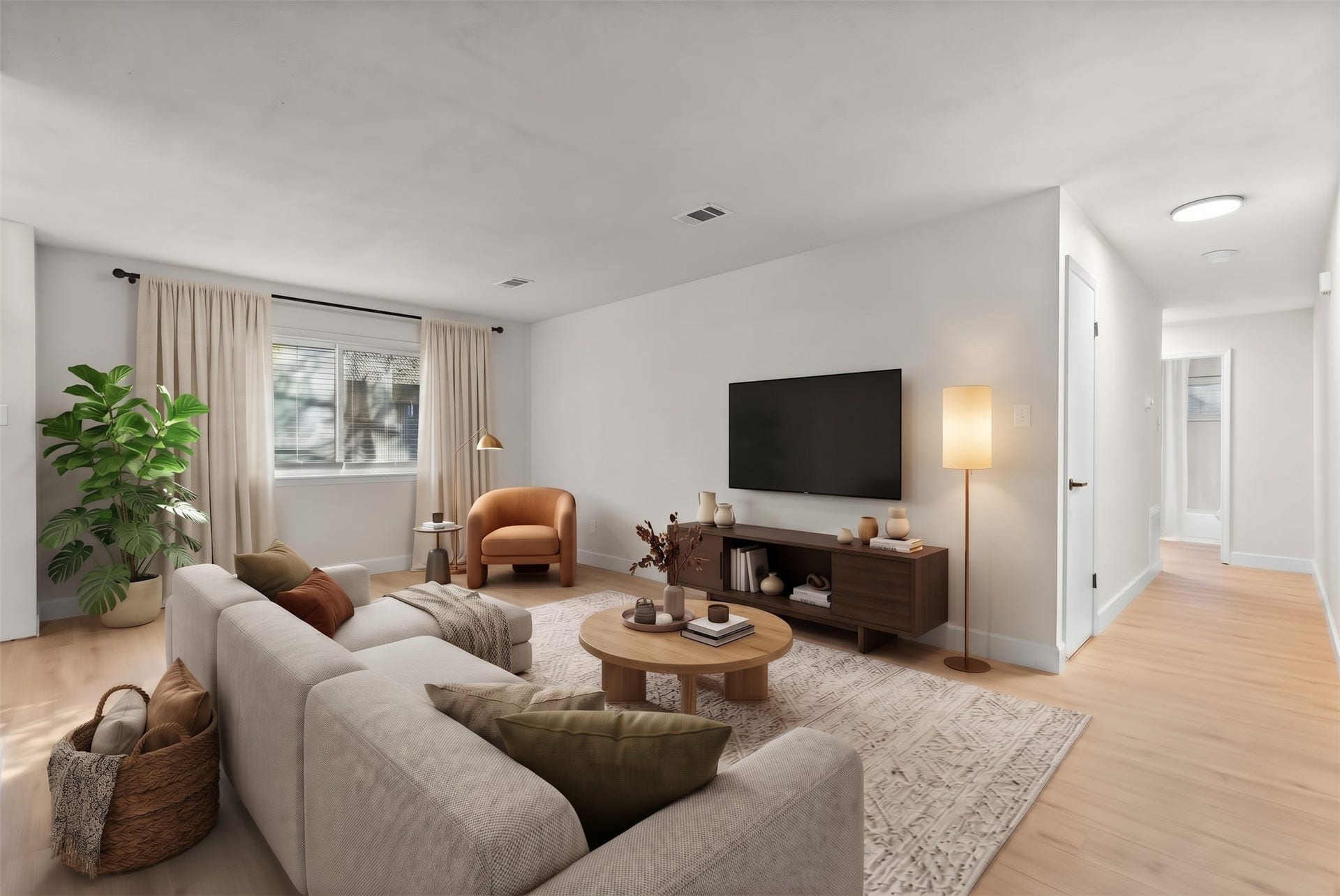 Expansive 19' x 11' living area highlighted by fresh paint, new baseboards, and luxury vinyl plank flooring throughout.