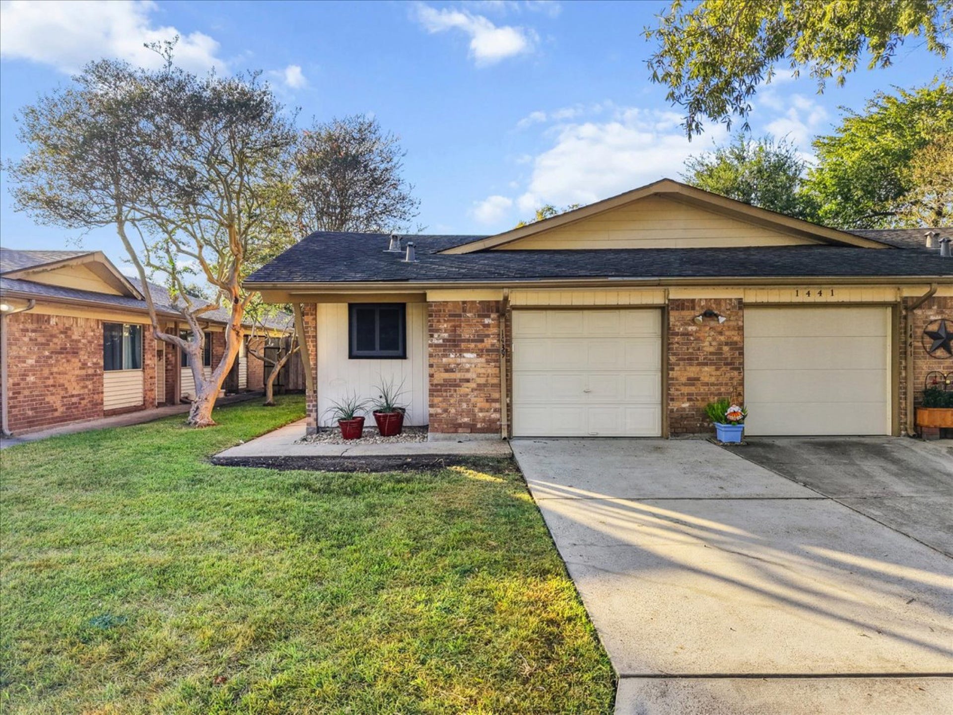 Features manicured curb appeal, an attached one-car garage, and double-pane energy-efficient windows.