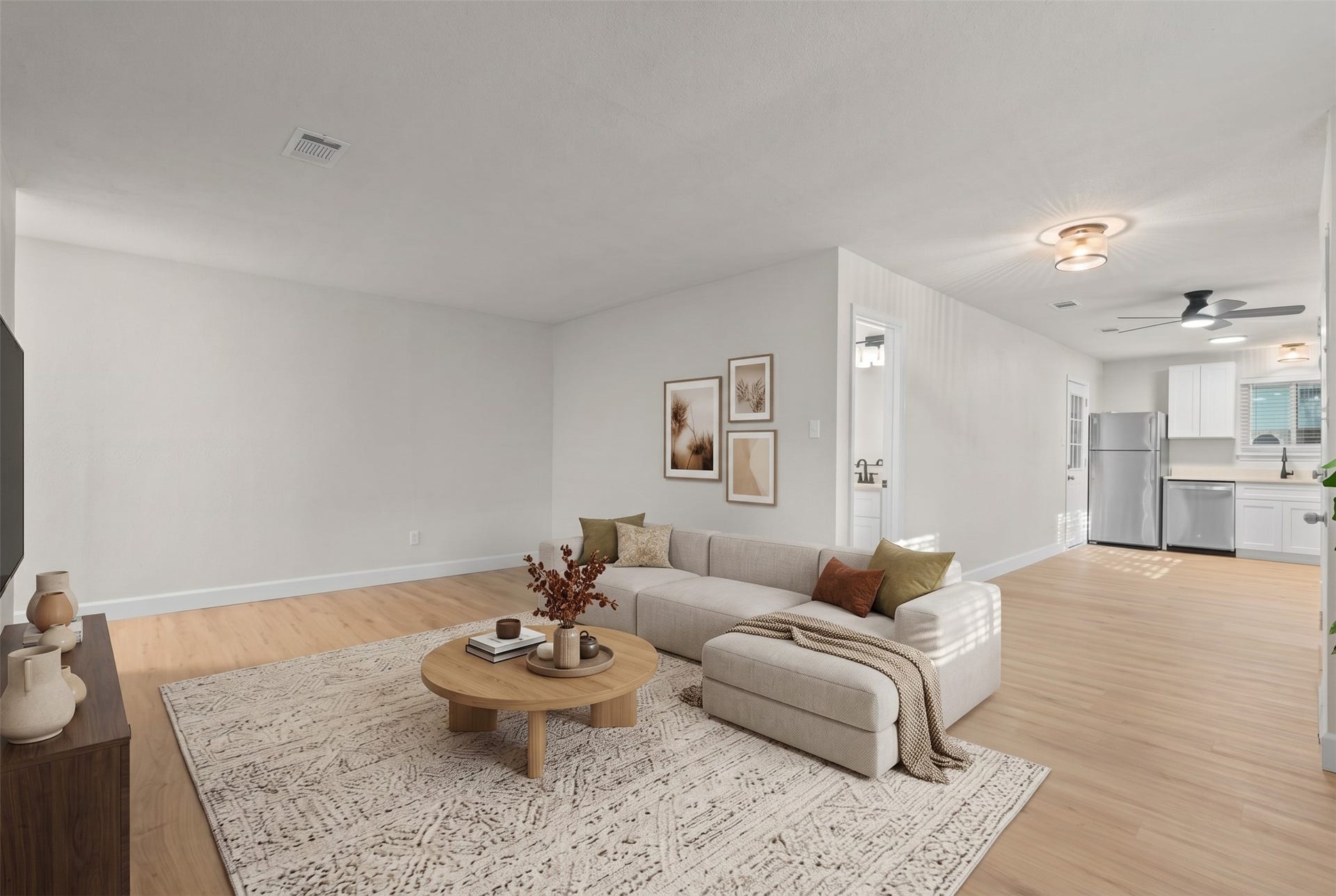 Bright, open-concept living area offering effortless flow into the dining space and kitchen, making entertaining easy.