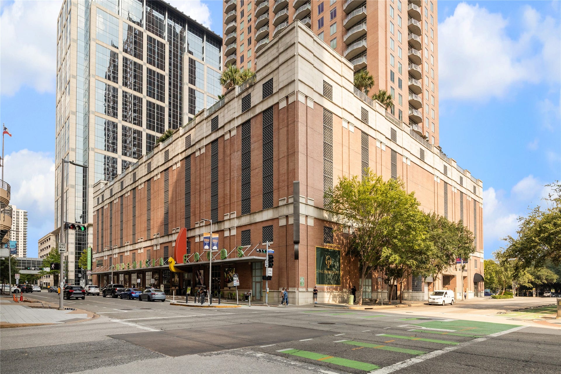 1111 Caroline Street, #2601, Houston, TX 77010 Phoenicia is shown as neighborhood context for downtown grocery shopping. Market adds an option for everyday provisions and specialty foods outside the building.