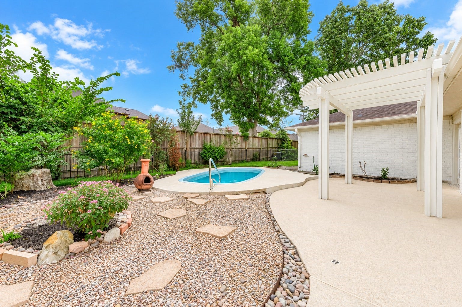 109 Dorado Drive, Friendswood, TX 77546 Private backyard retreat featuring a swimming pool and patio.