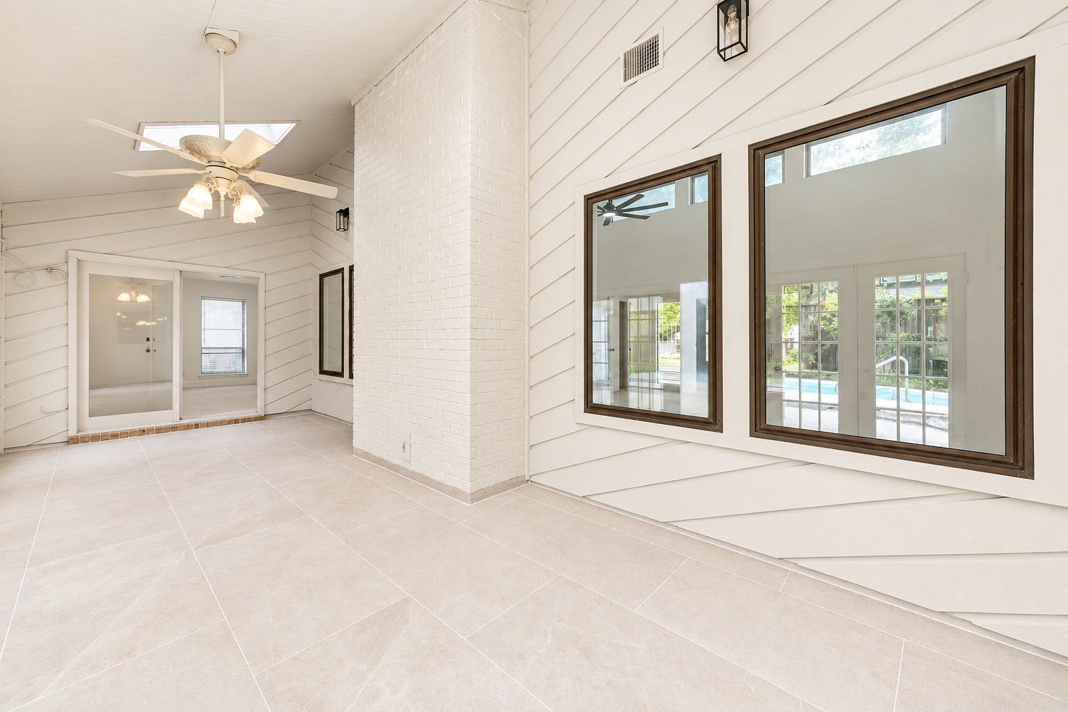109 Dorado Drive, Friendswood, TX 77546 Alternative view of the sunroom showcasing the spacious layout and backyard views.